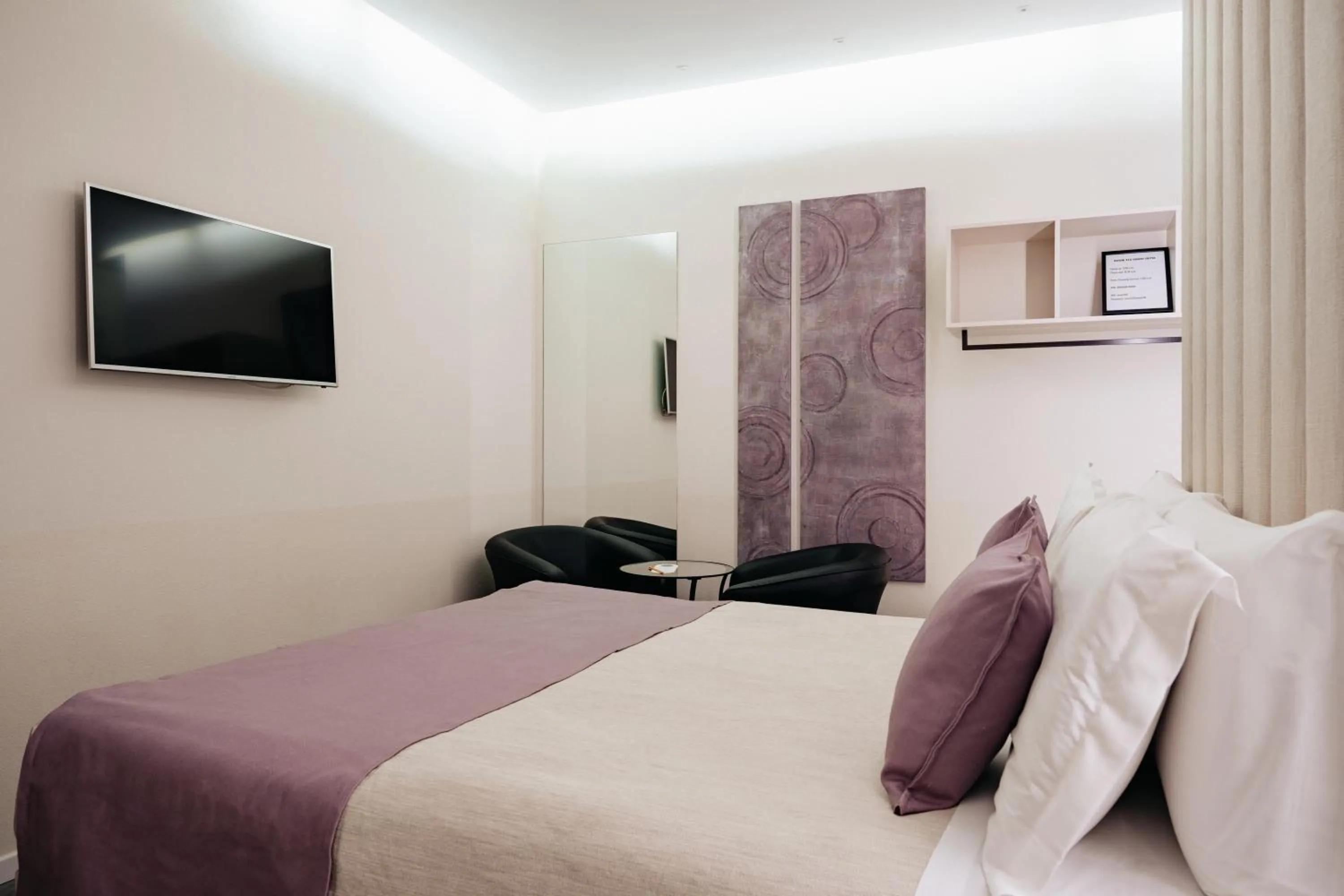 Bed in Room 230 Roma Luxury Suites