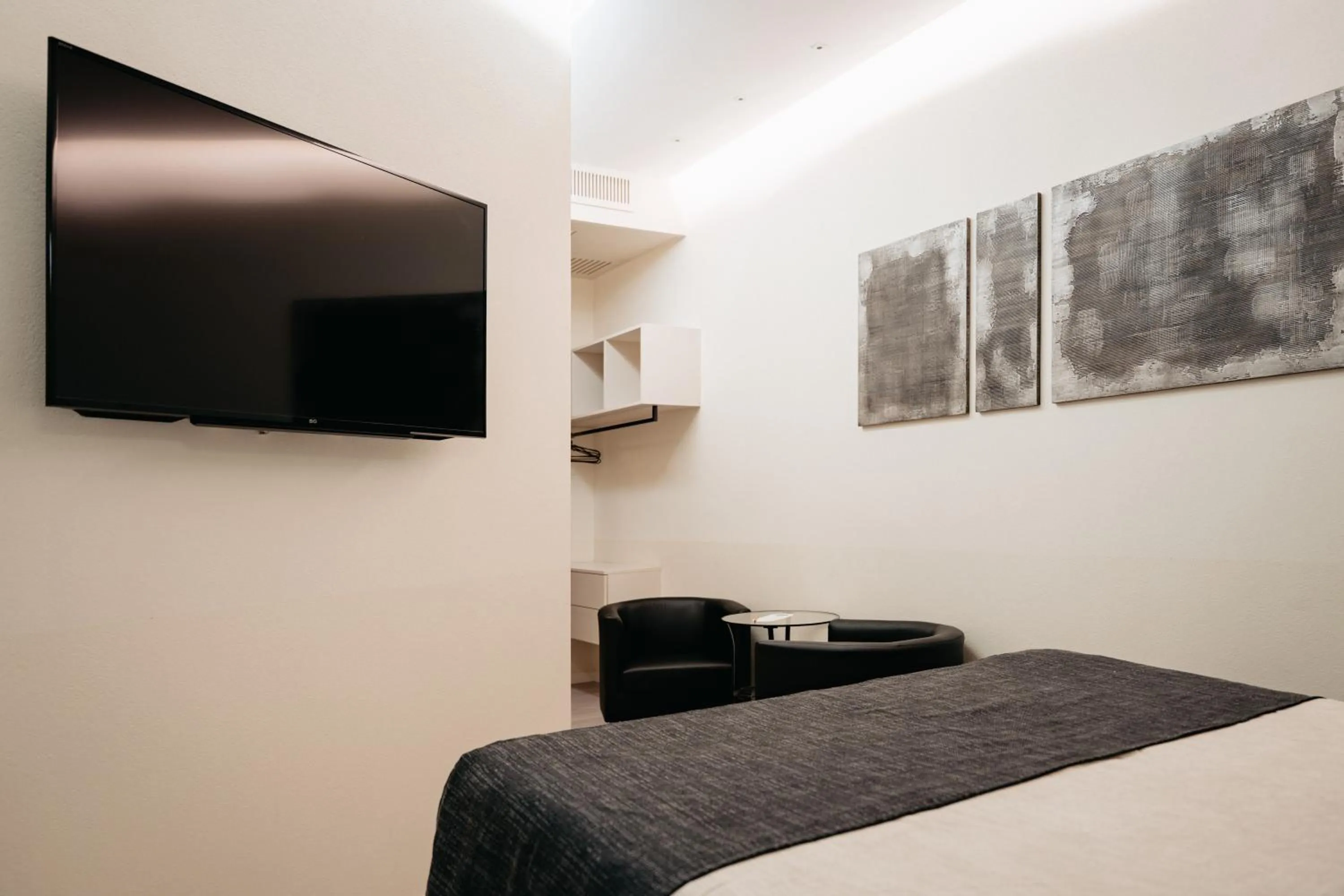 Bed in Room 230 Roma Luxury Suites