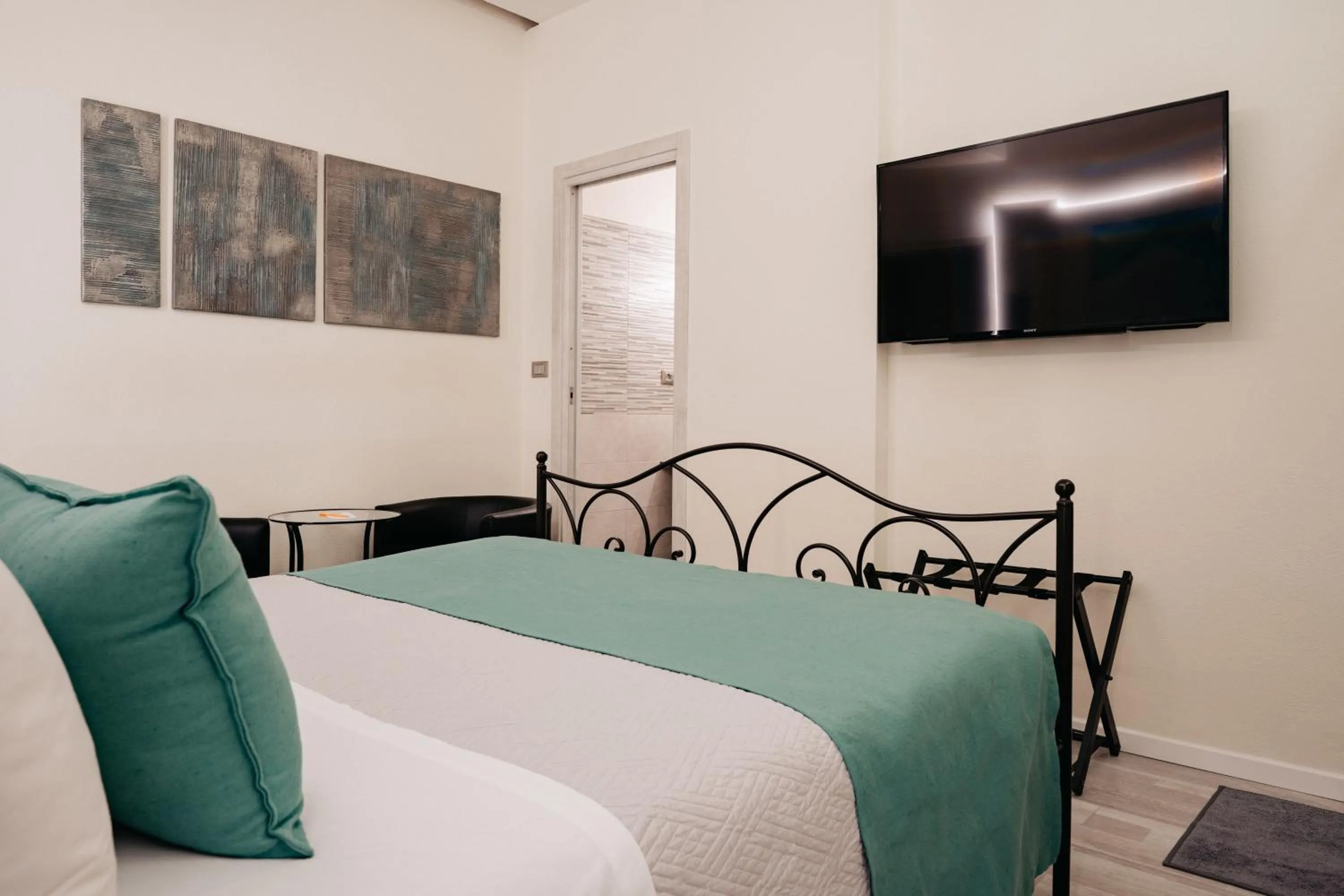 Bed in Room 230 Roma Luxury Suites