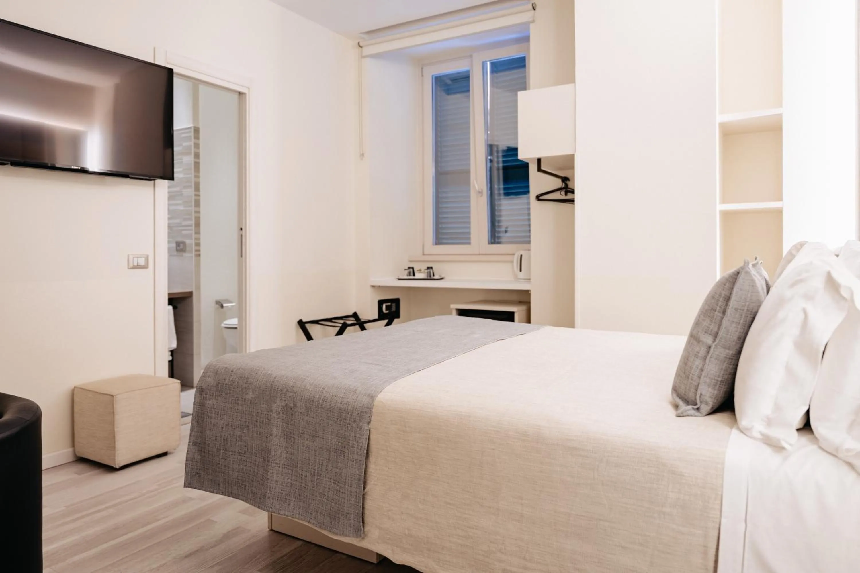 Bed in Room 230 Roma Luxury Suites