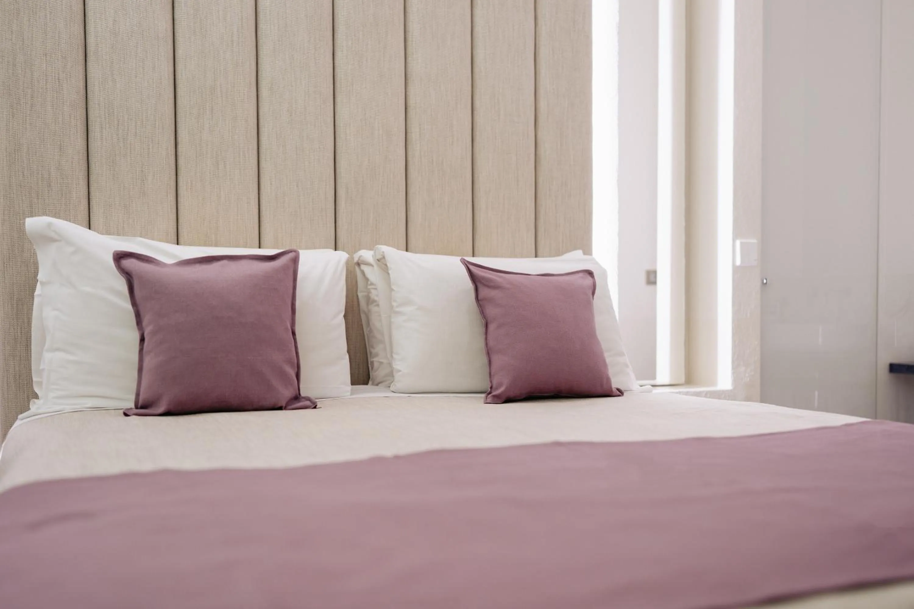 Bed in Room 230 Roma Luxury Suites