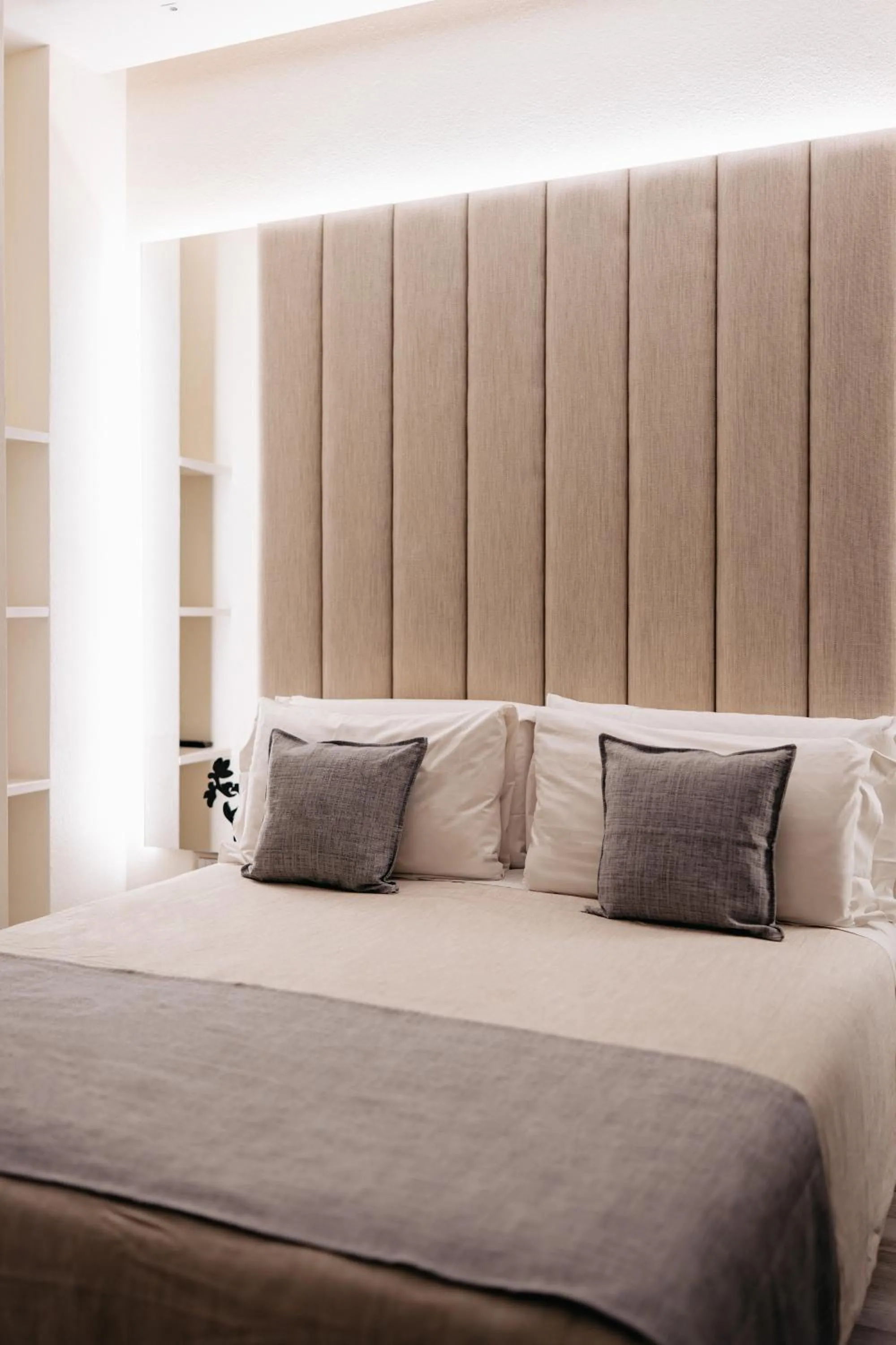 Bed in Room 230 Roma Luxury Suites