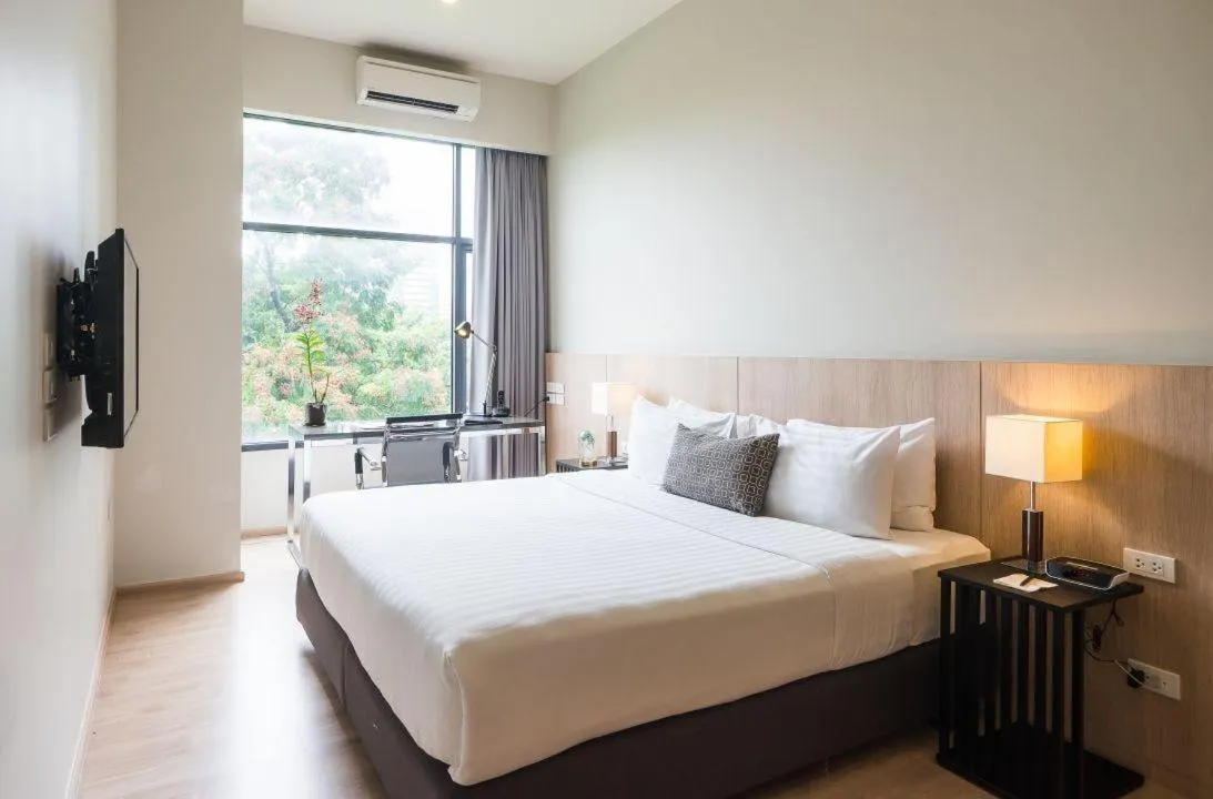 Seating area, Bed in The Residence on Thonglor by UHG