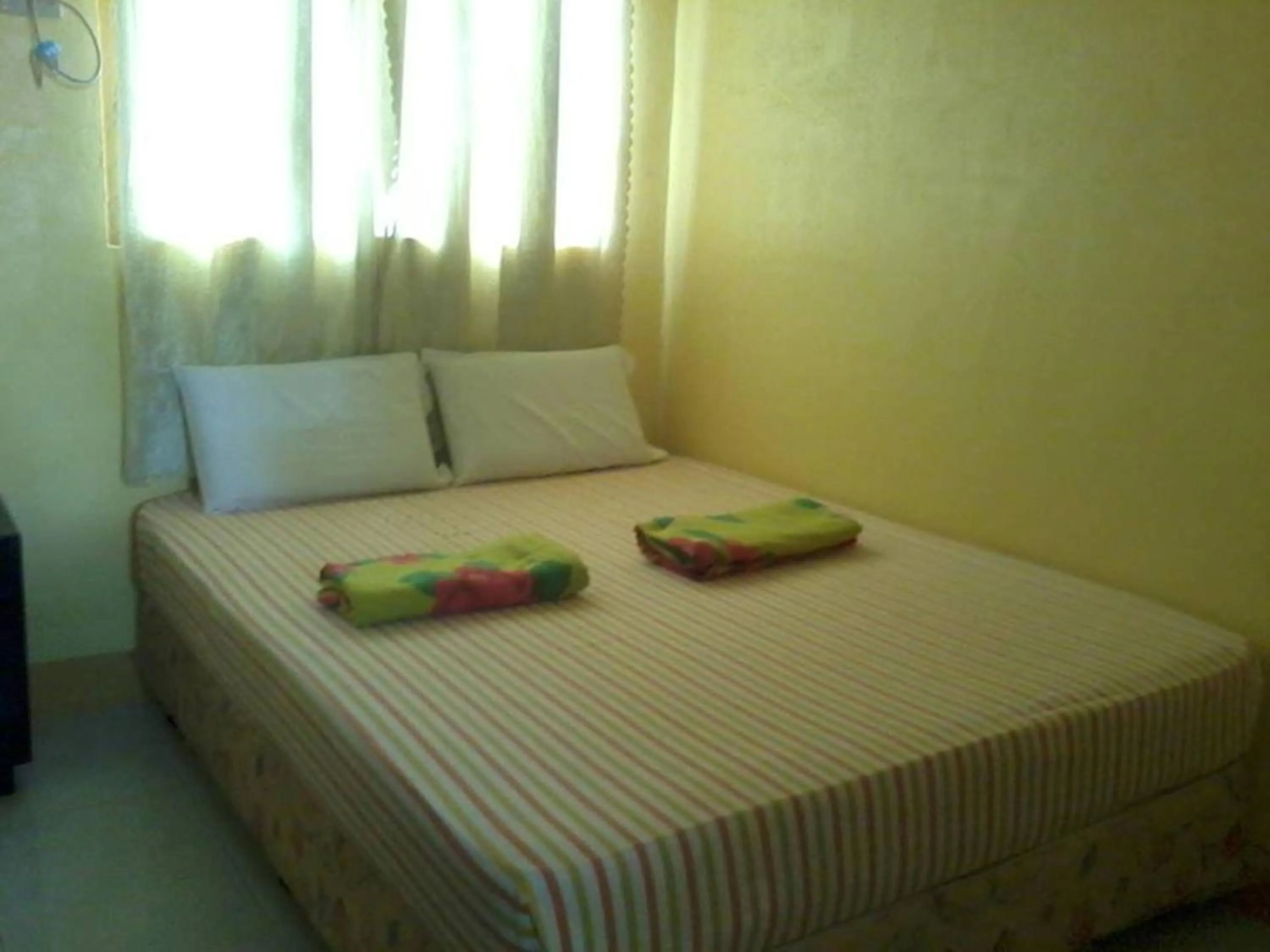 Bed in Pabua's Cottages