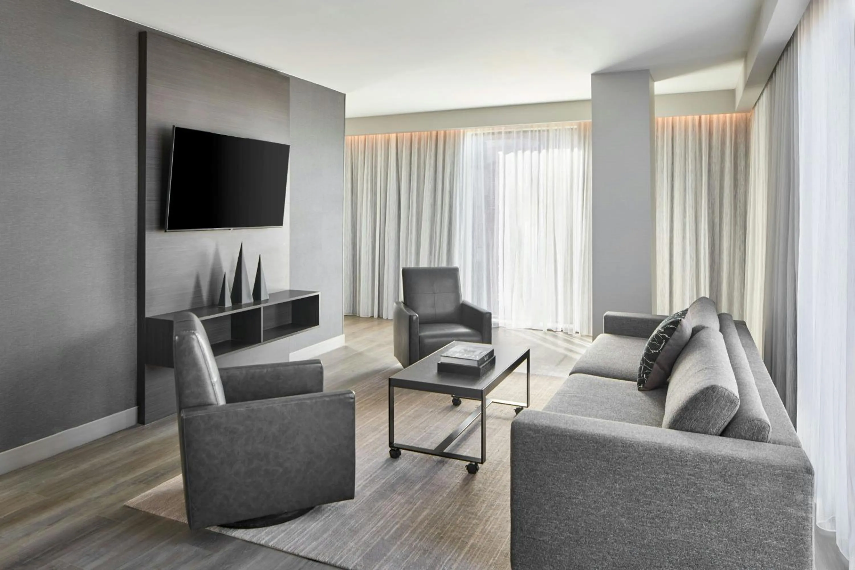 Living room in AC Hotel by Marriott Auburn