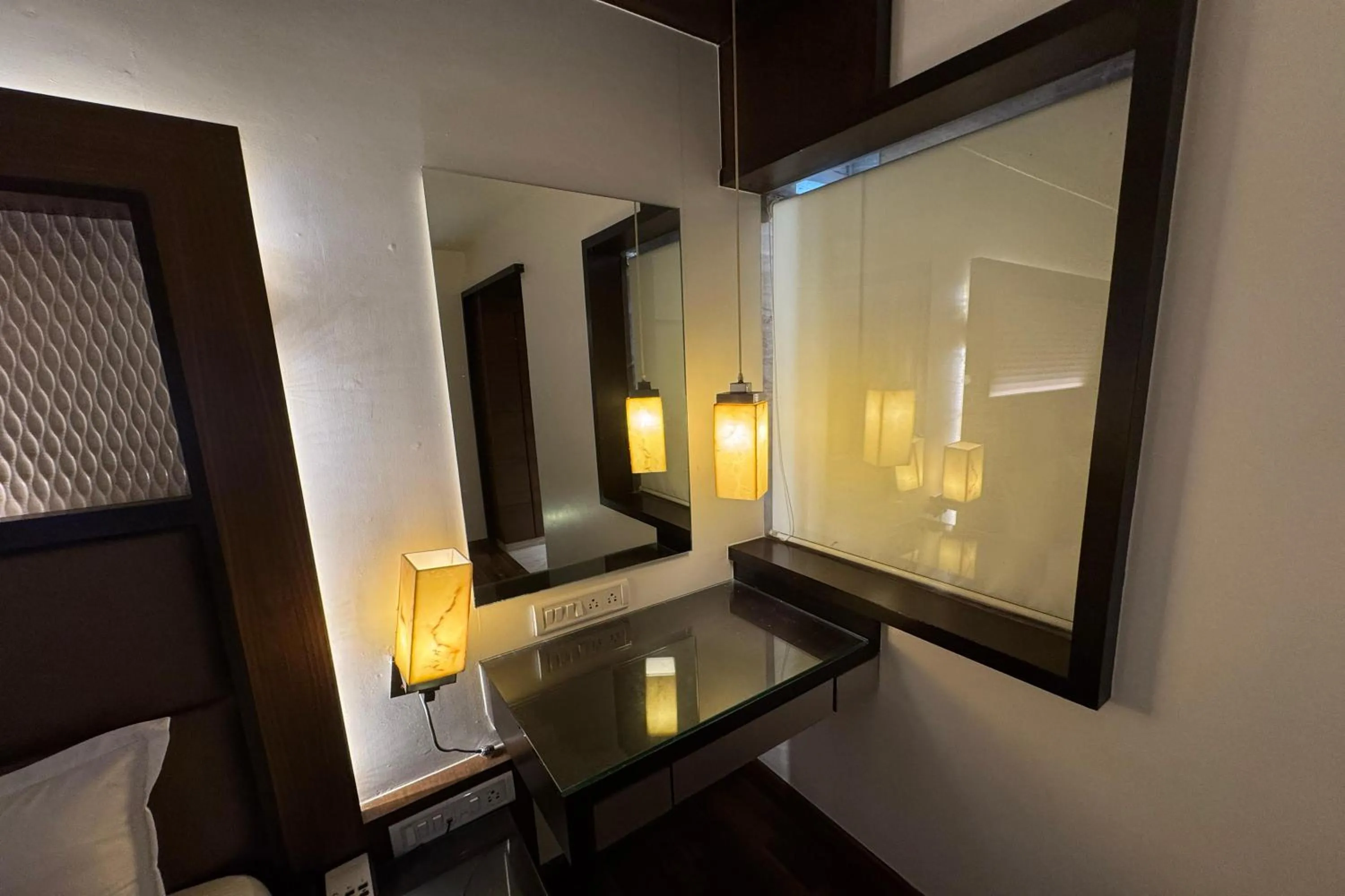 Bedroom in Hotel Dwaraka Residency