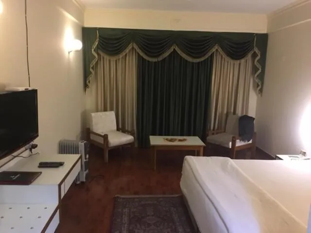 Seating area, Bed in Shiva Oasis Resort