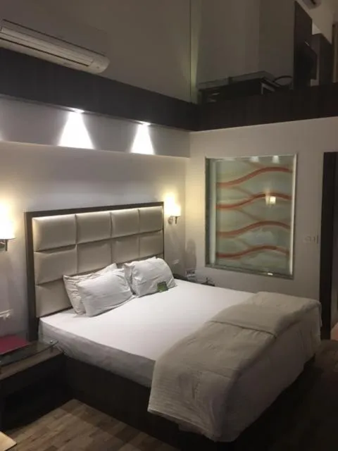 Bed in Shiva Oasis Resort