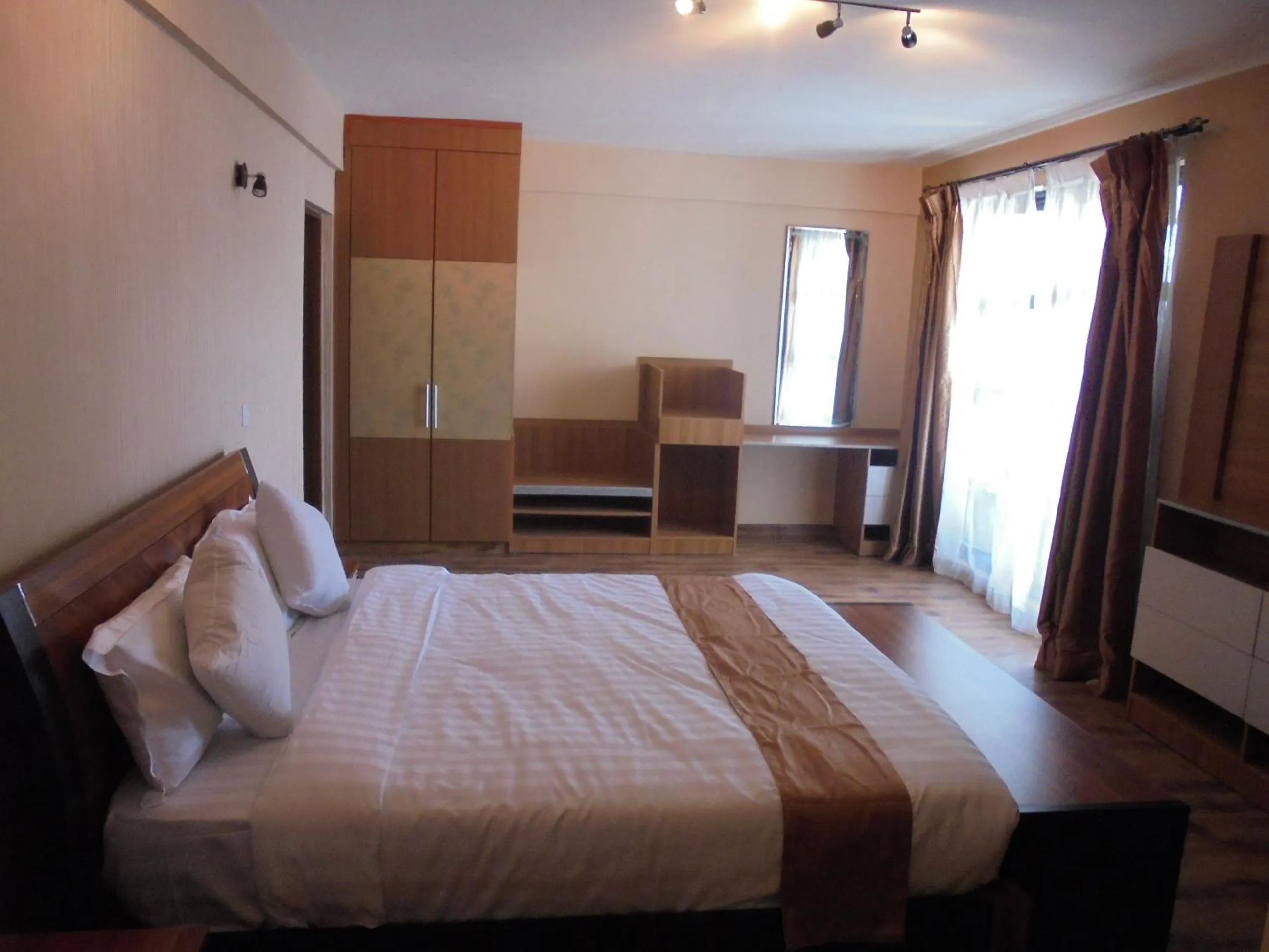 Photo of the whole room, Bed in We Hotel and Suites