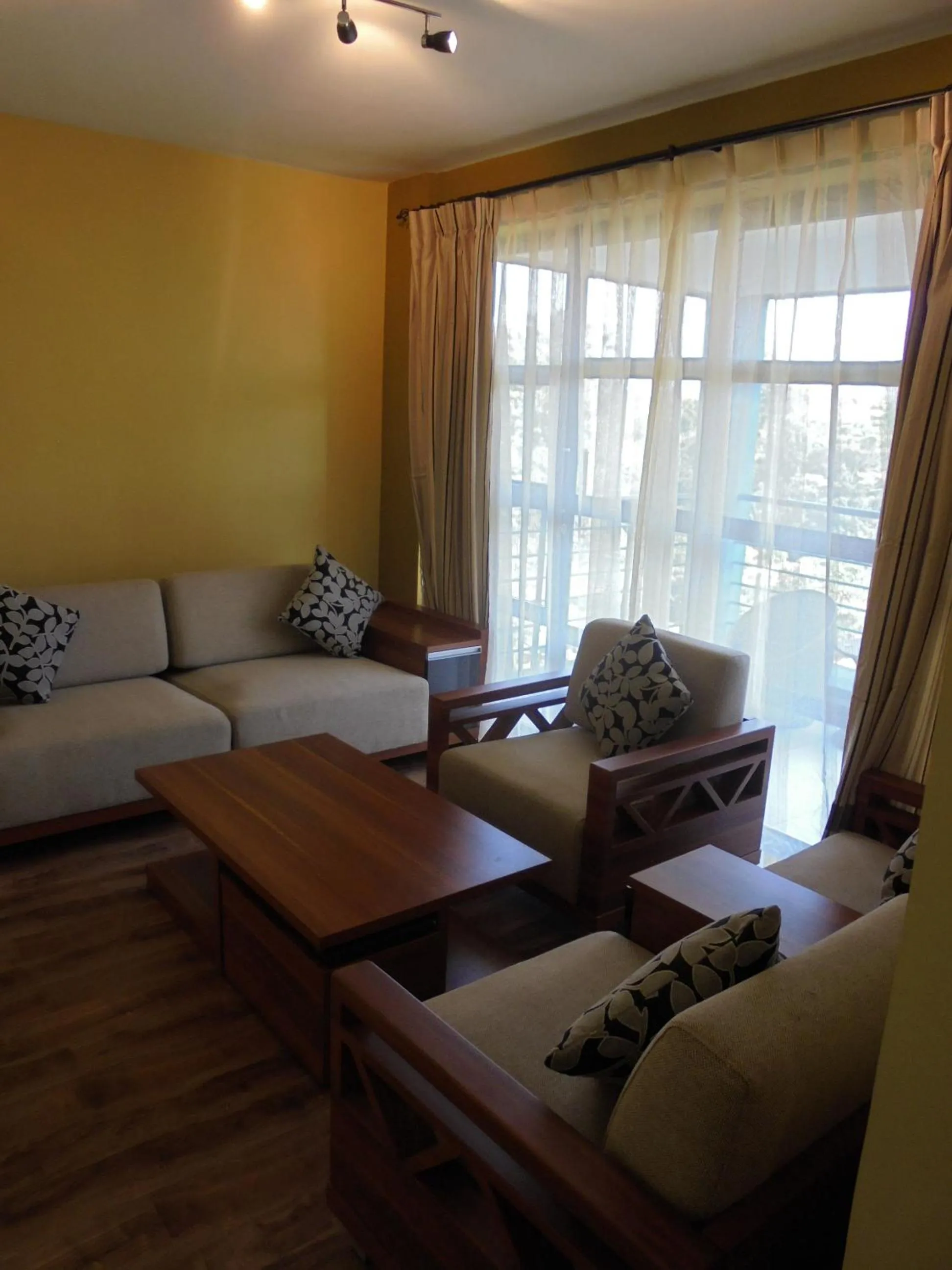 Communal lounge/ TV room in We Hotel and Suites