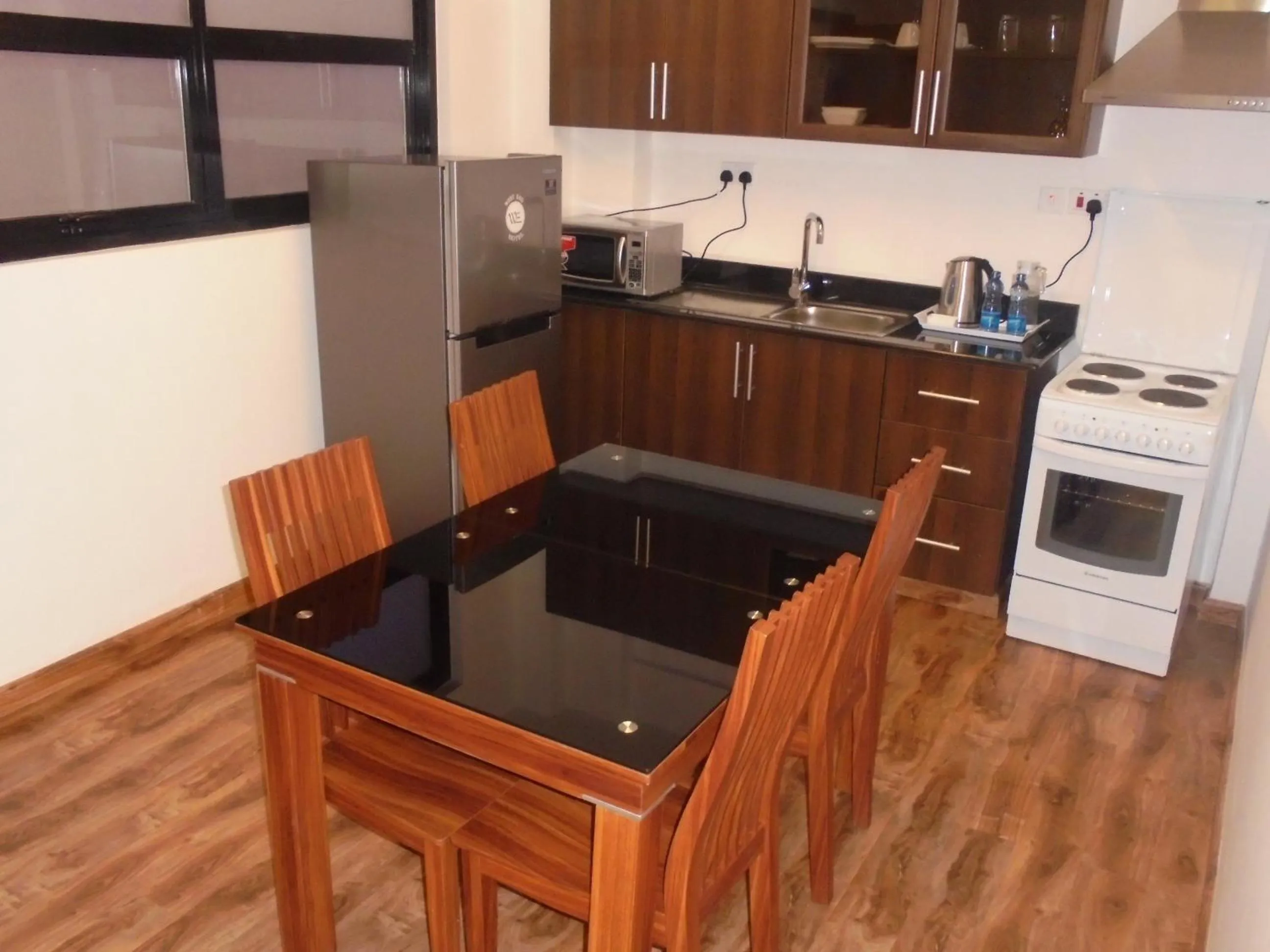 Communal kitchen in We Hotel and Suites