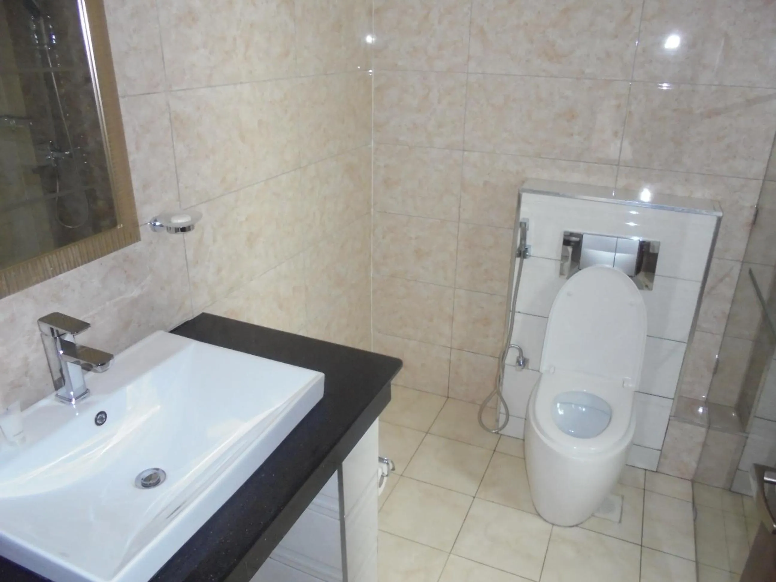 Bathroom in We Hotel and Suites