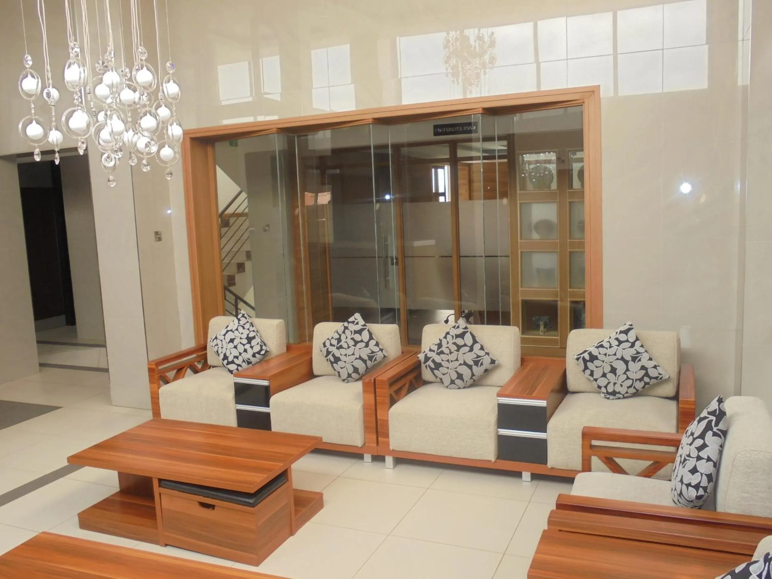 Communal lounge/ TV room in We Hotel and Suites