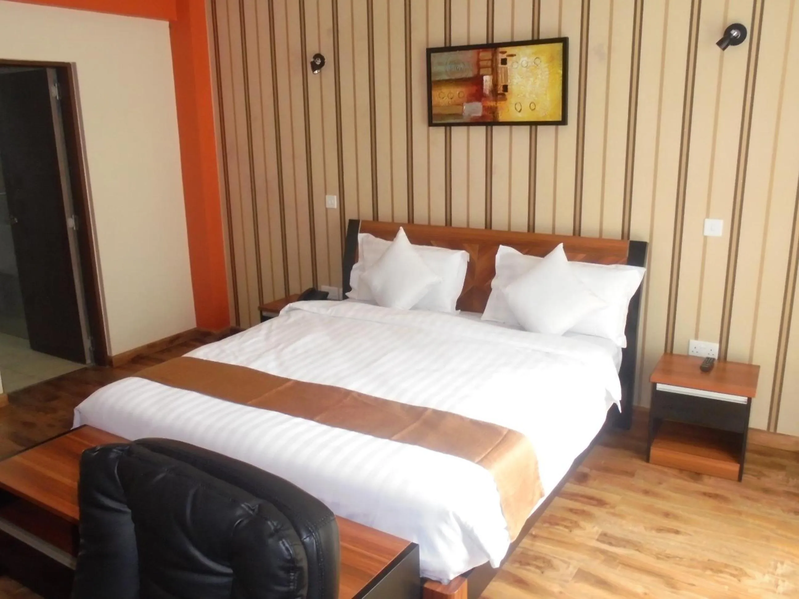 Photo of the whole room, Bed in We Hotel and Suites