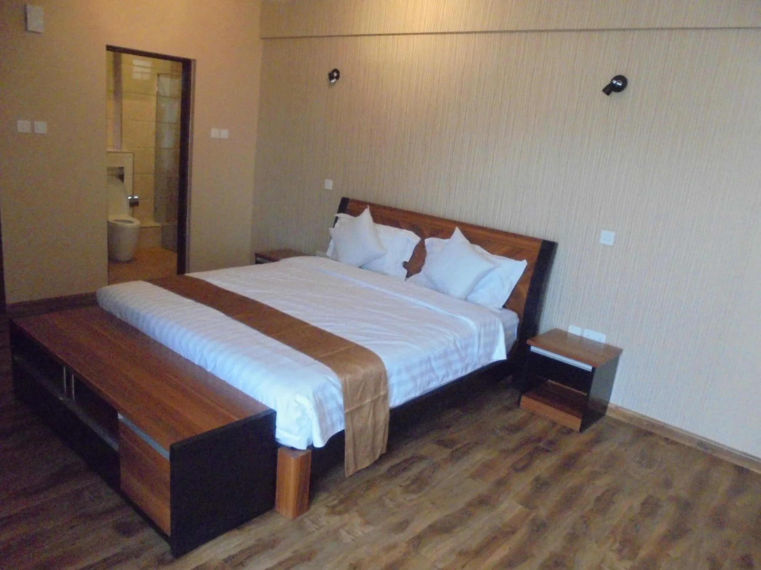 Bed in We Hotel and Suites