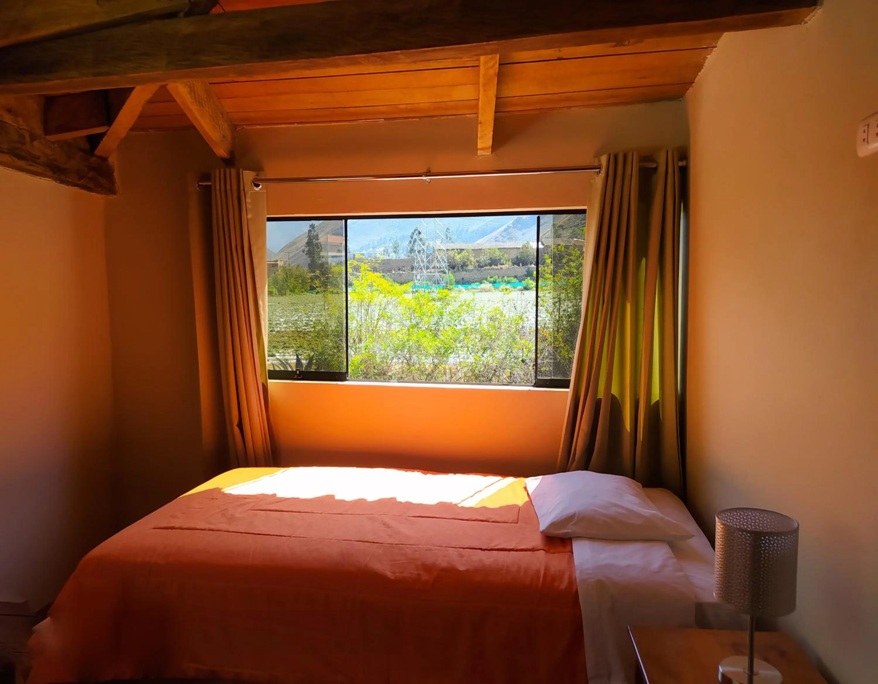 Bed in Tambo de Ollantay Hotel