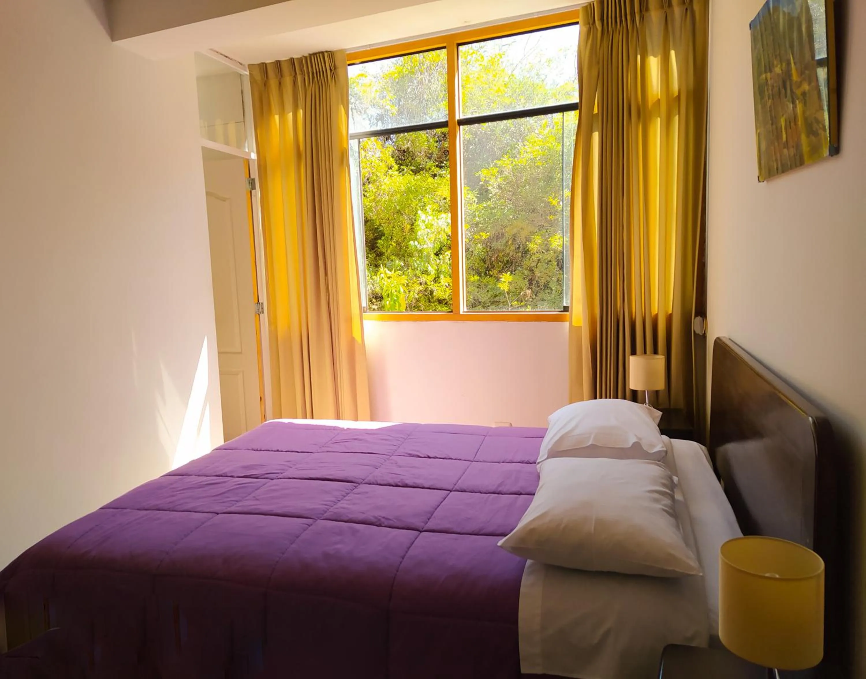 Bed in Tambo de Ollantay Hotel