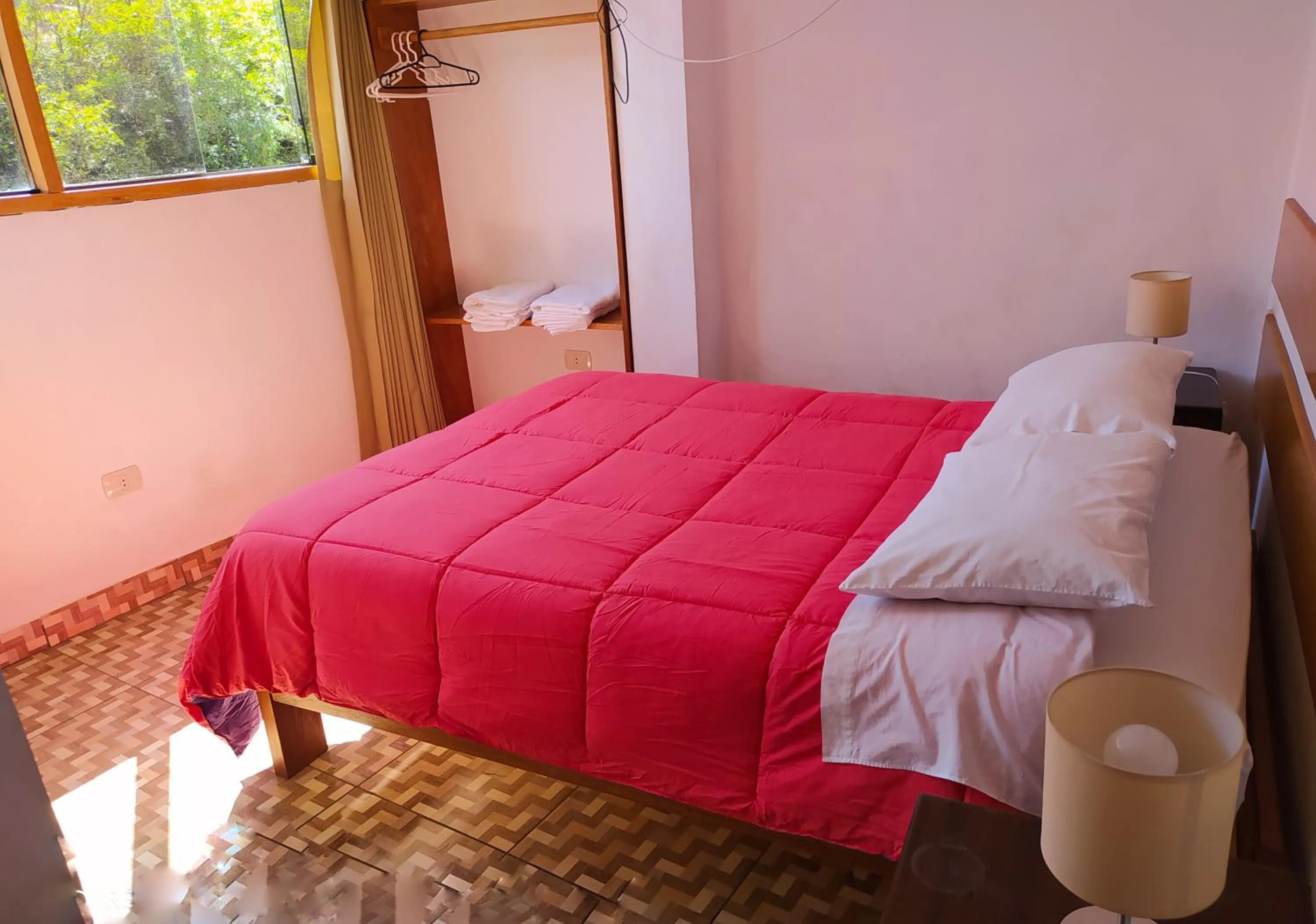 Bed in Tambo de Ollantay Hotel