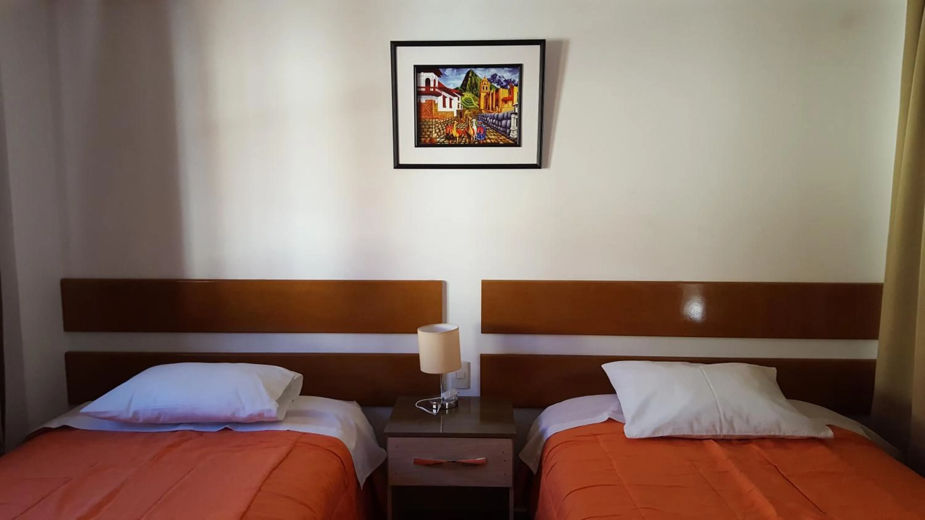 Bed in Tambo de Ollantay Hotel