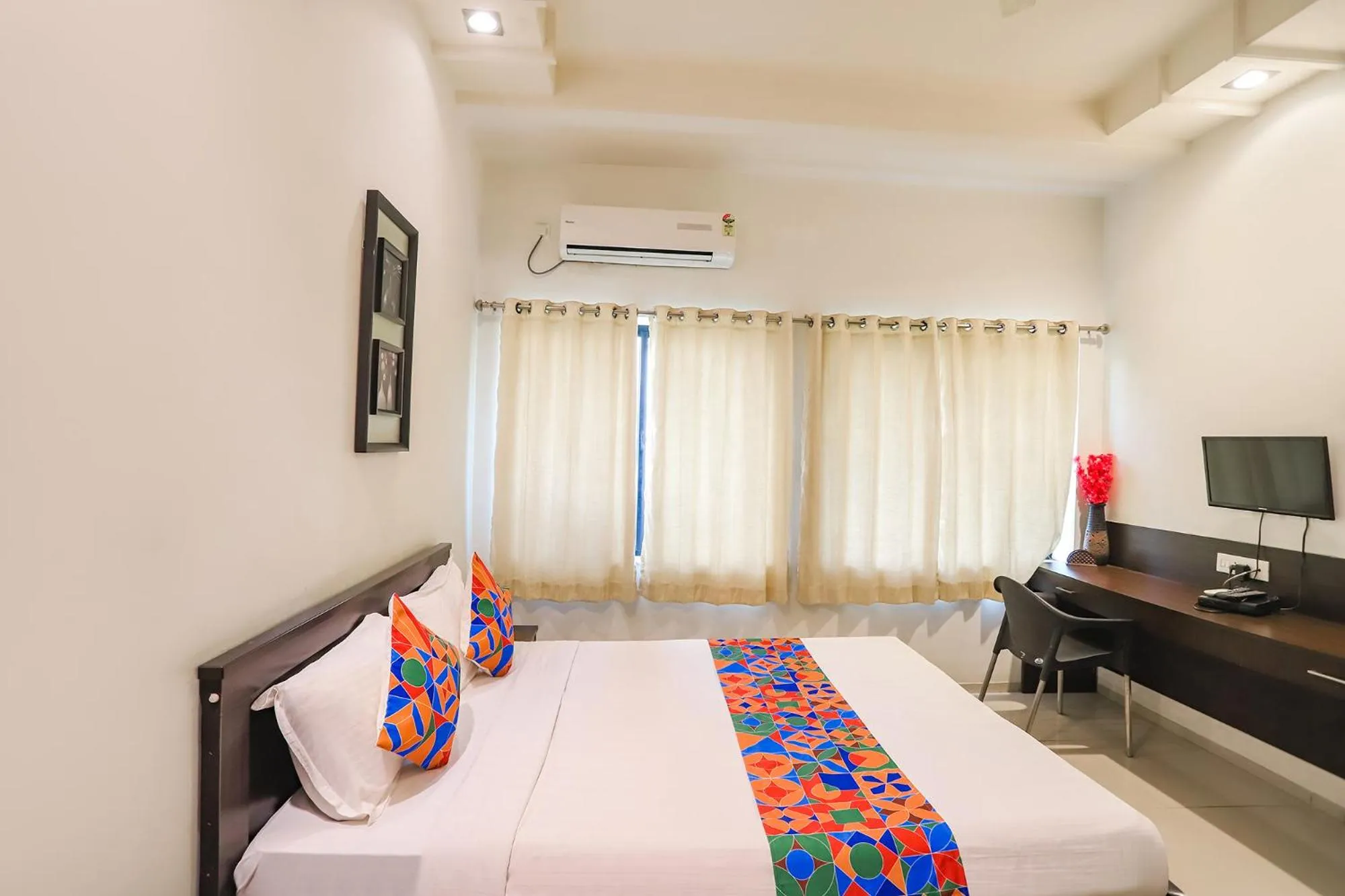 Bed in FabHotel Archanil Apartment - Sitanagar Cricket Ground