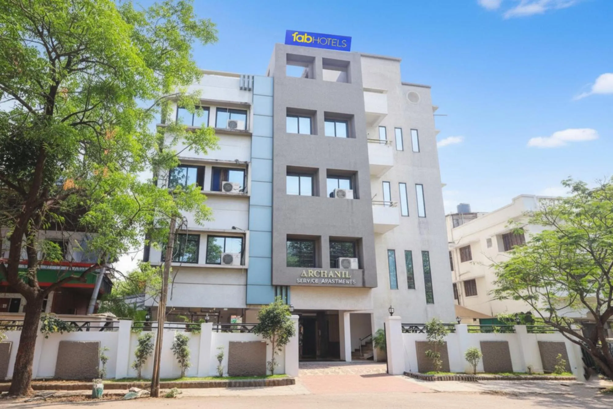 Property building in FabHotel Archanil Apartment - Sitanagar Cricket Ground