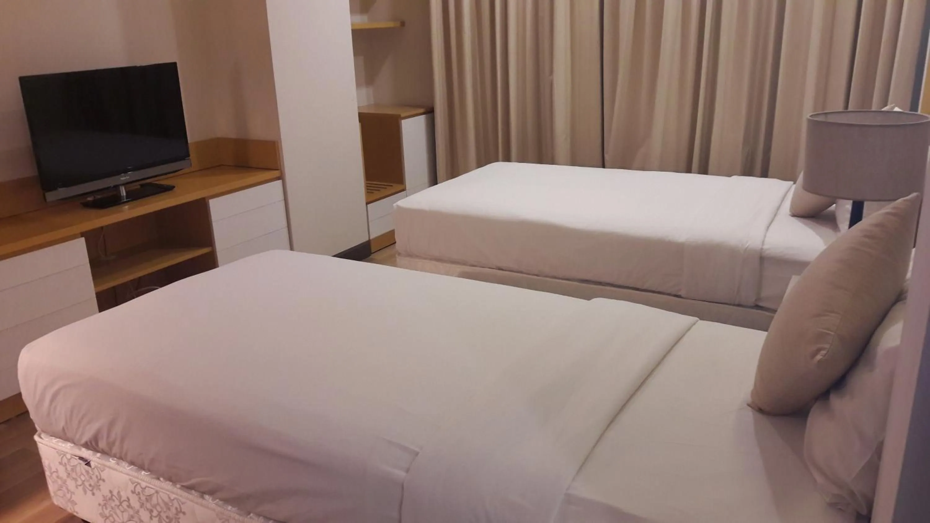 Bed in Bluesky Serviced Apartment Airport Plaza