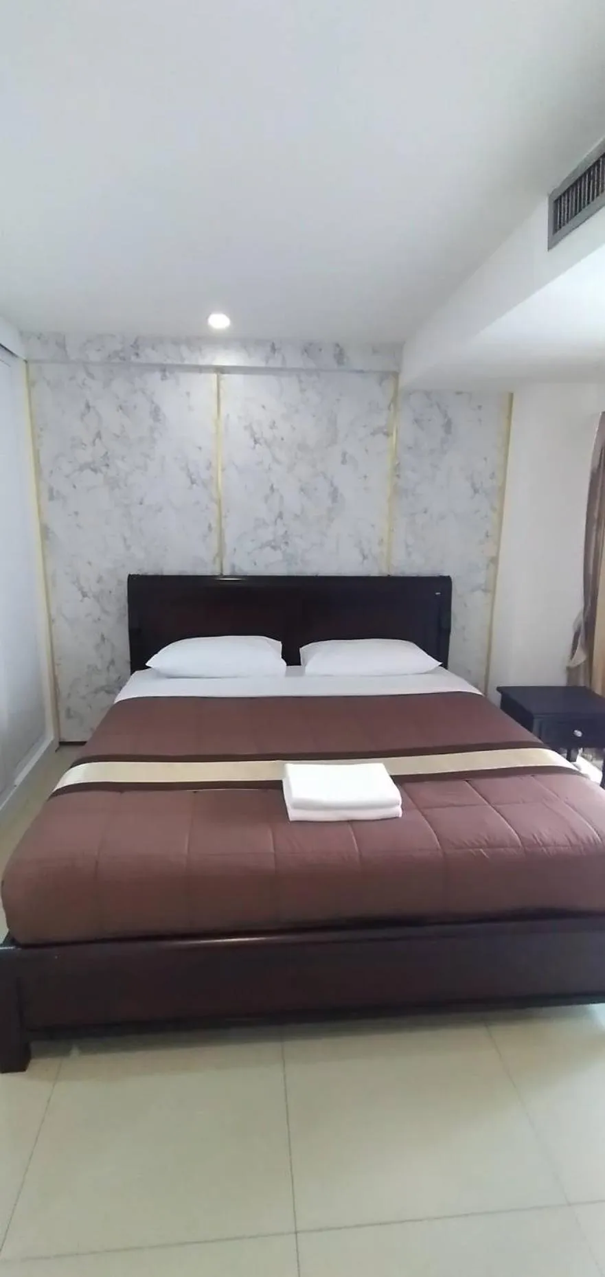 Bed in Nanatai Suites