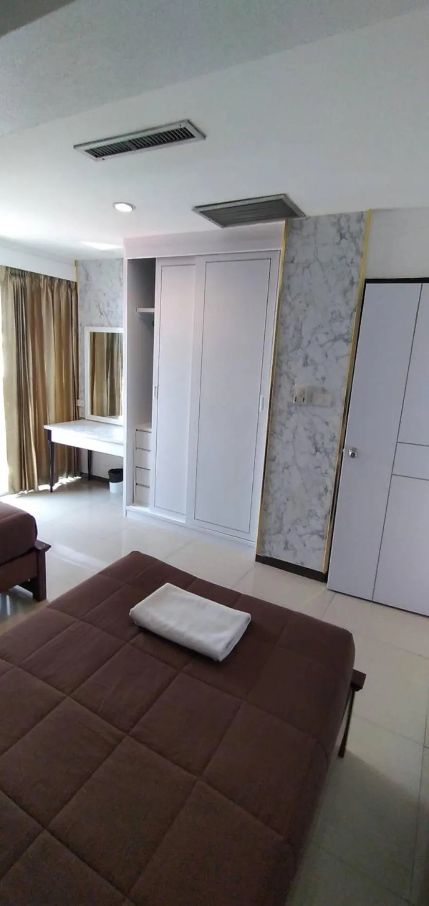 Bed in Nanatai Suites