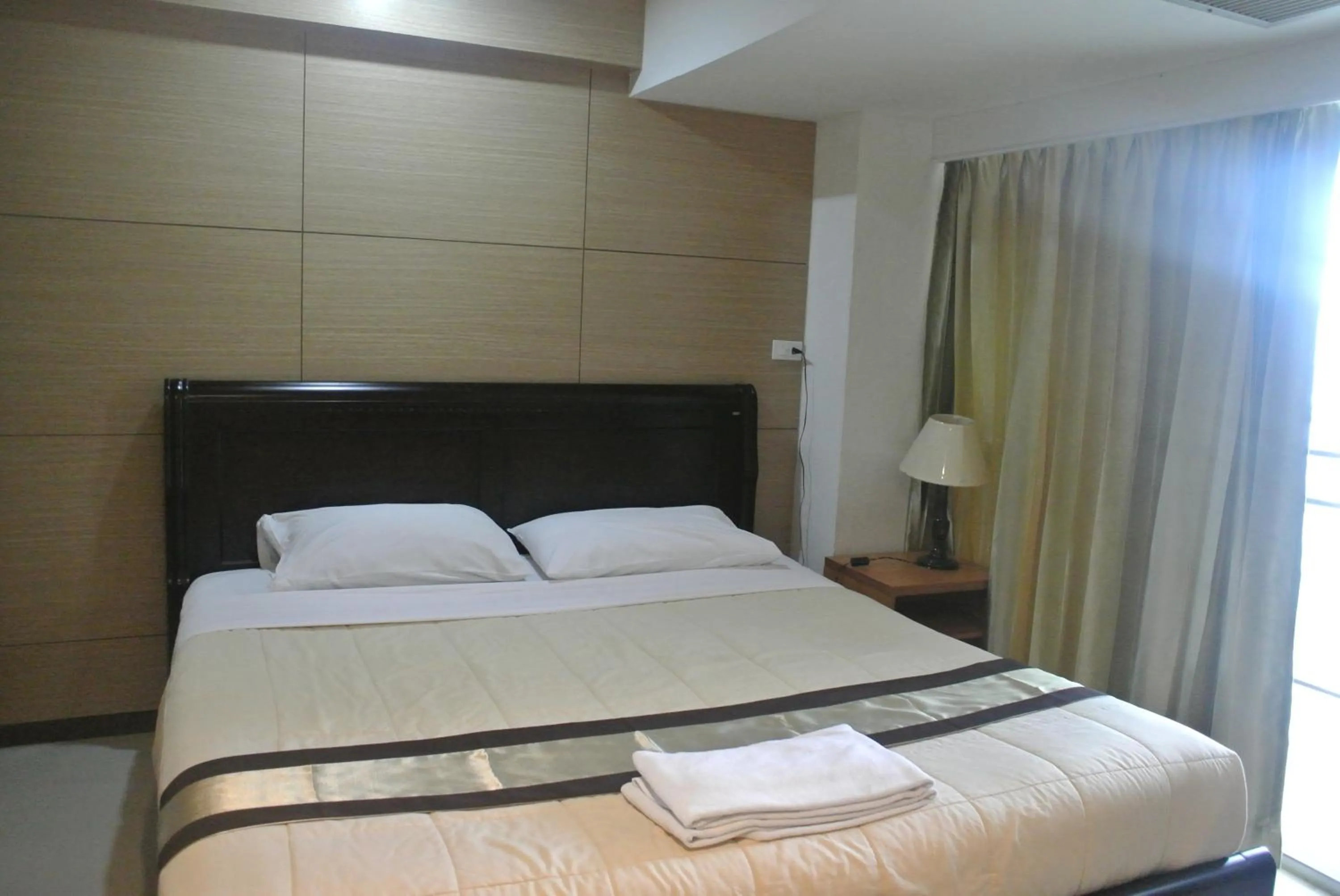 Bed in Nanatai Suites
