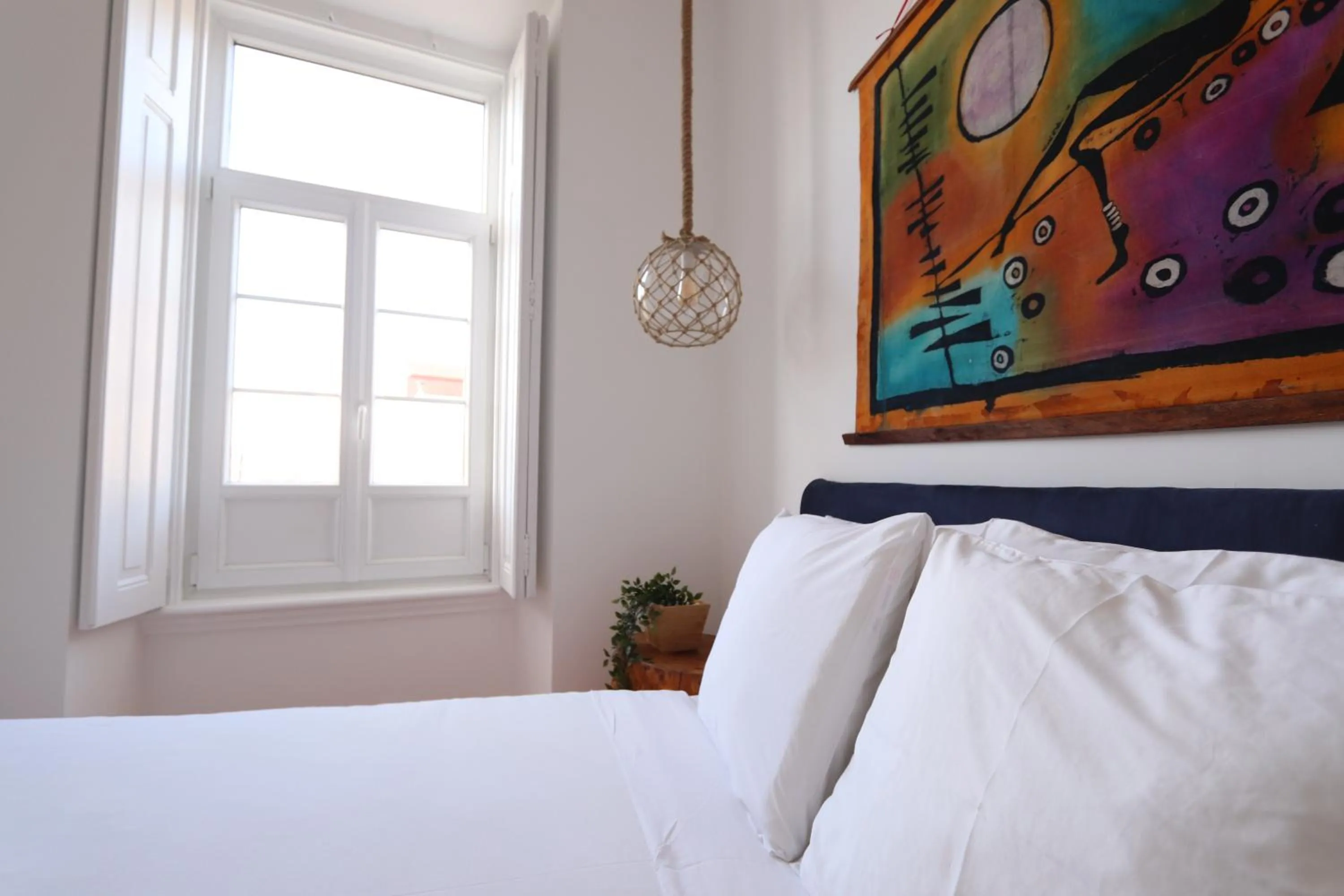 Bed in Flores Guest House