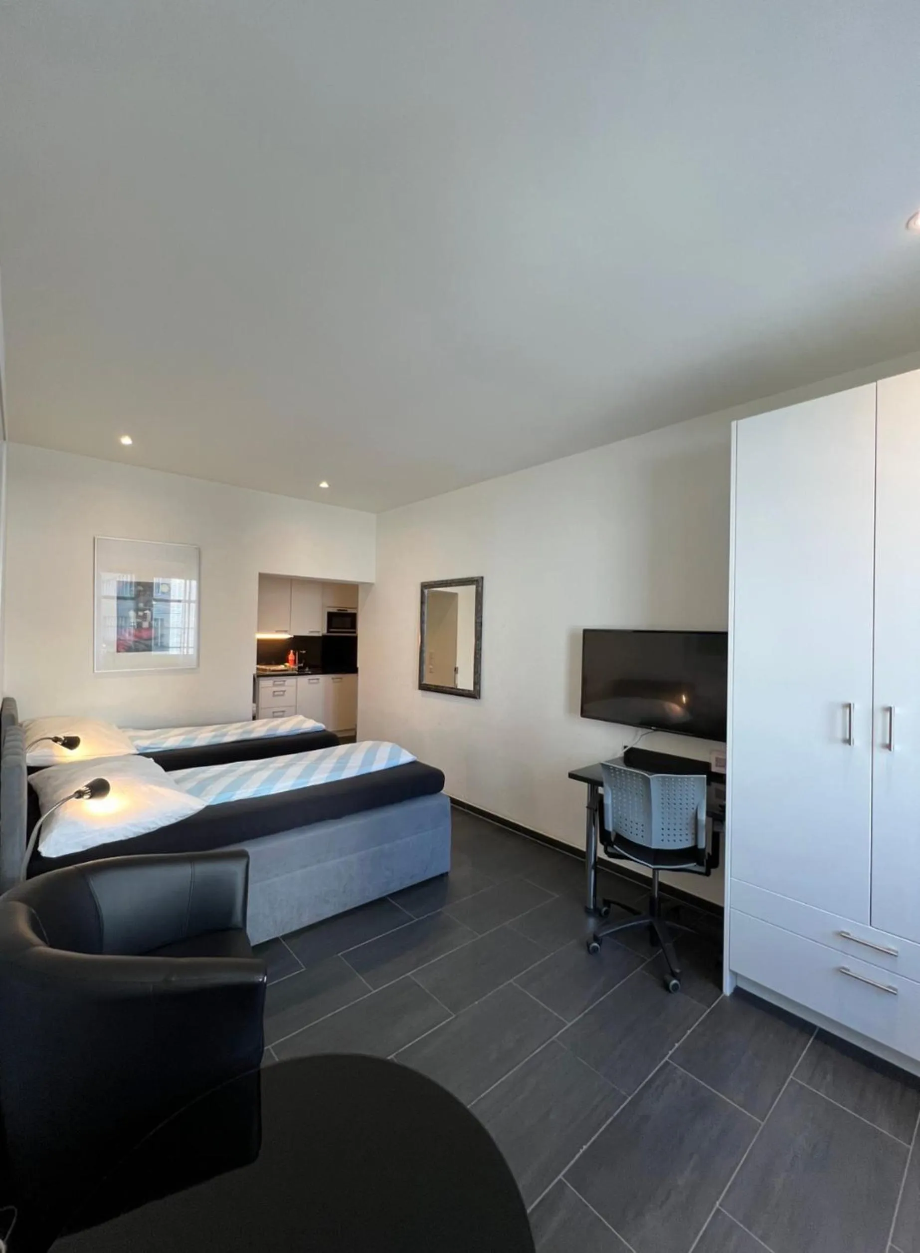 Communal lounge/ TV room, Bed in Seefeld Residenz