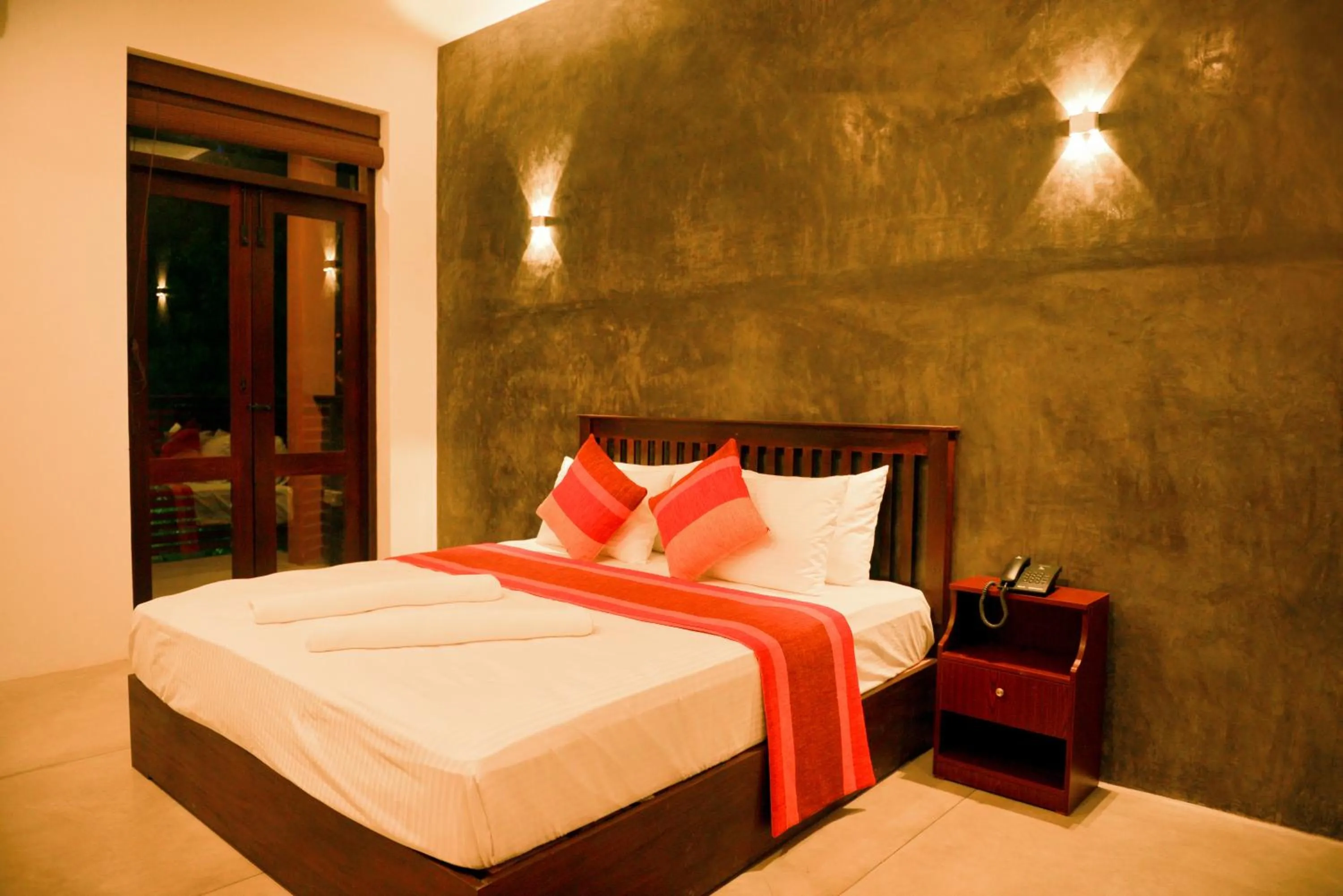 Bed in Olanro Hotel Negombo