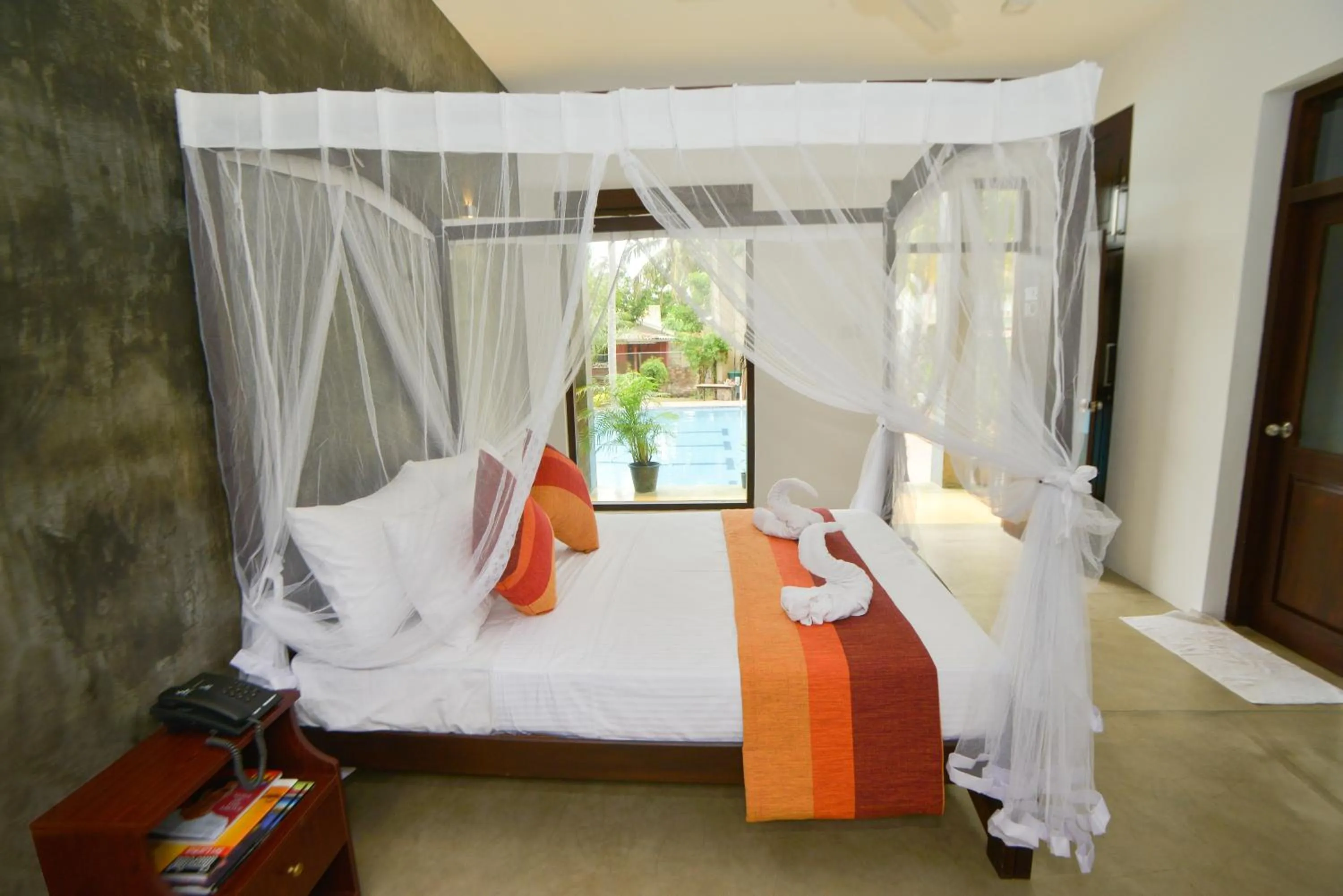Bed in Olanro Hotel Negombo