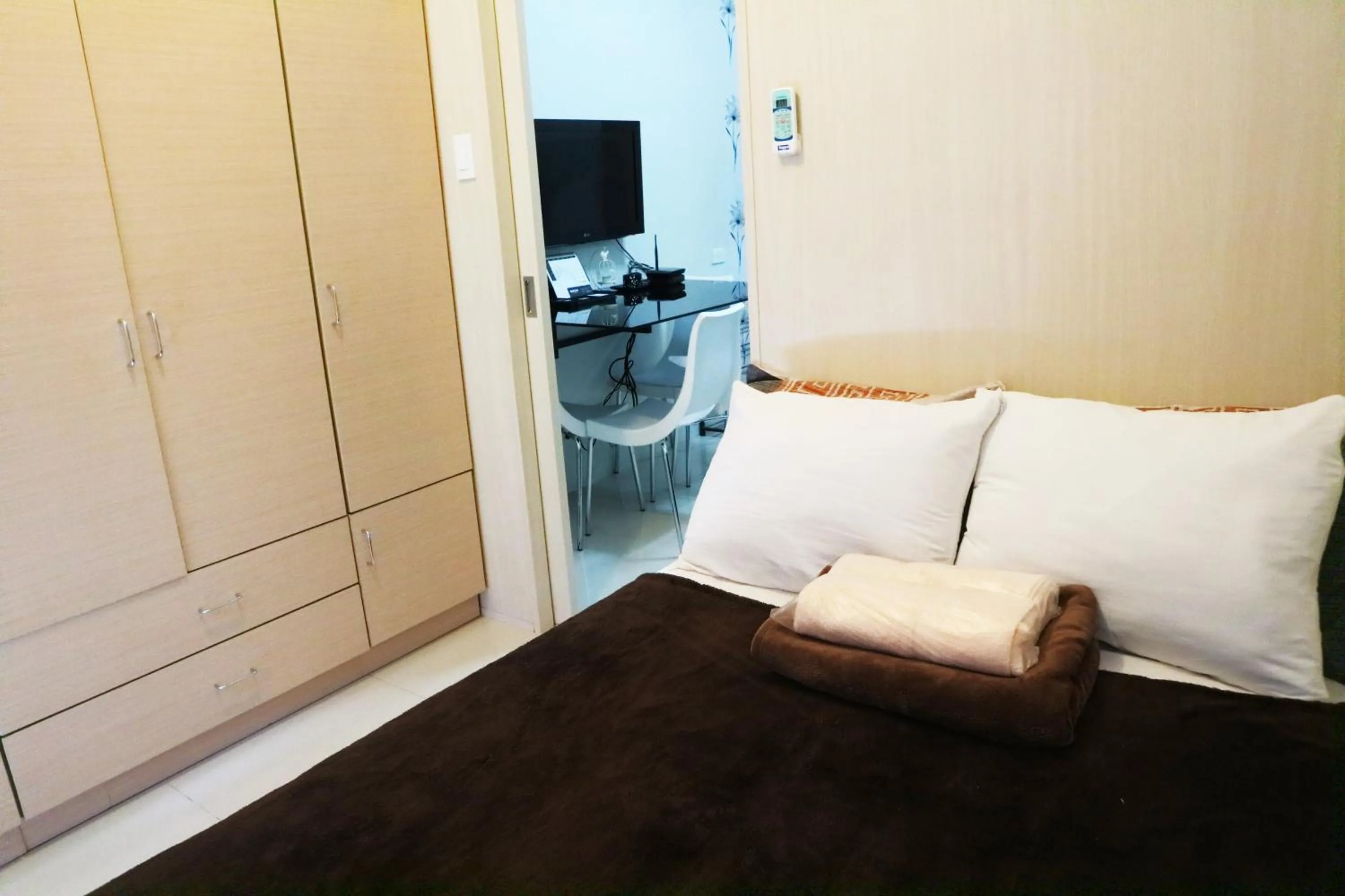 Bed in CondoDeal at Sea Residences