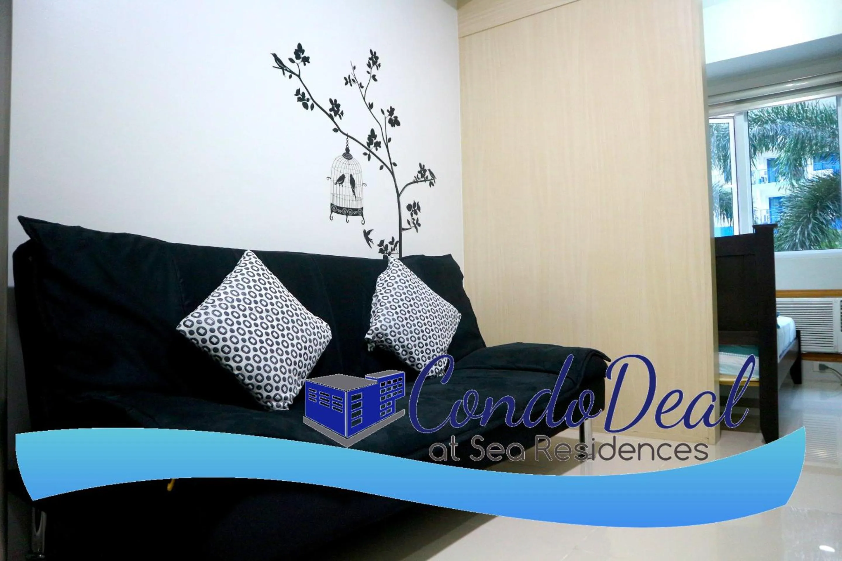 Living room in CondoDeal at Sea Residences