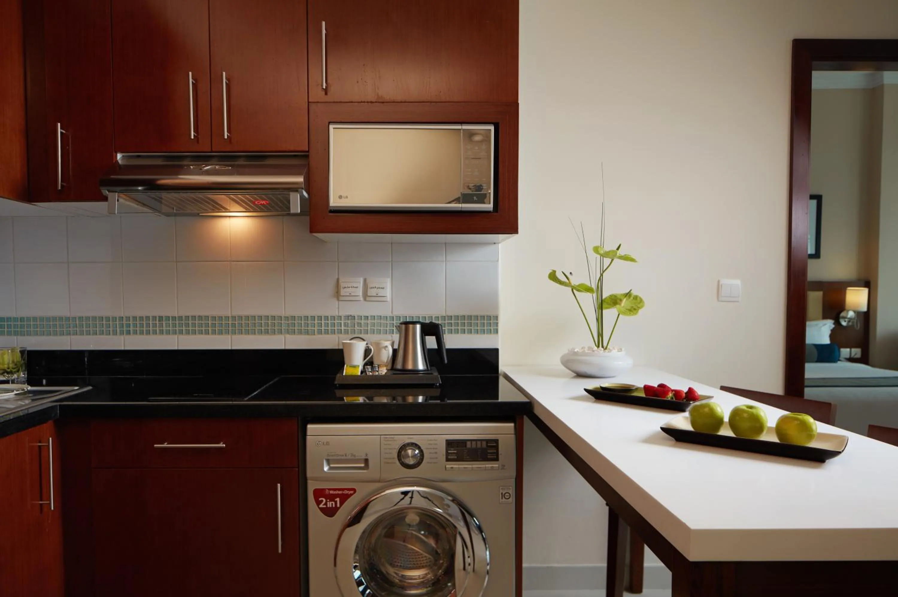 Kitchen or kitchenette in Treppan Hotel & Suites By Fakhruddin