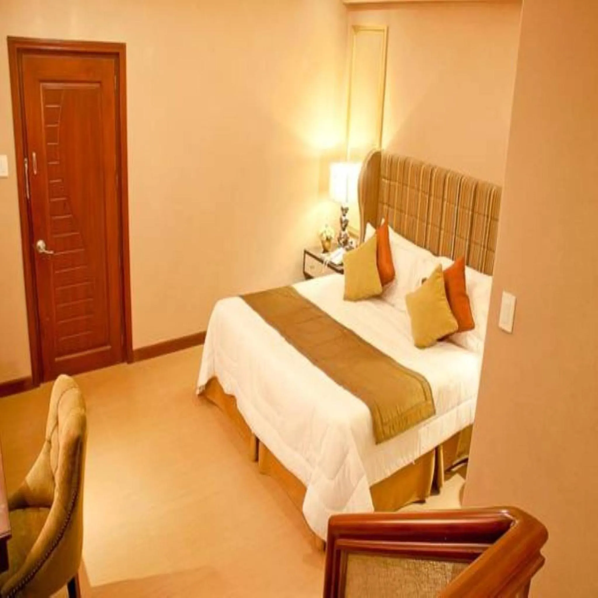 Bed in Royal Garden Hotel