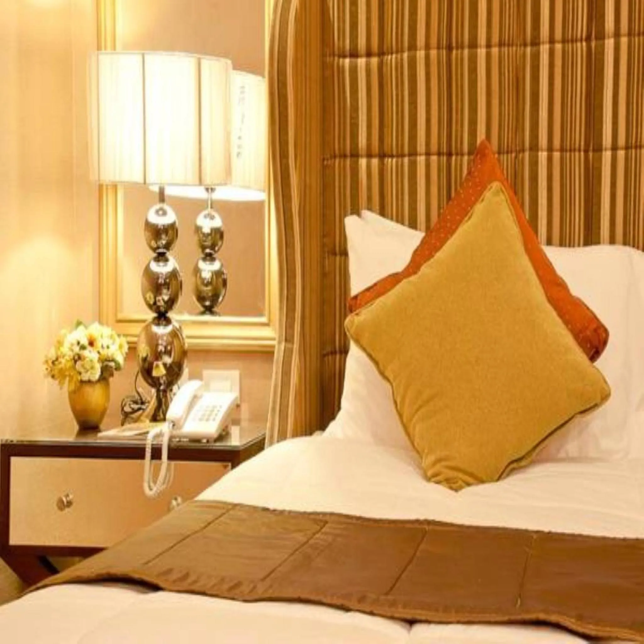 Bed in Royal Garden Hotel