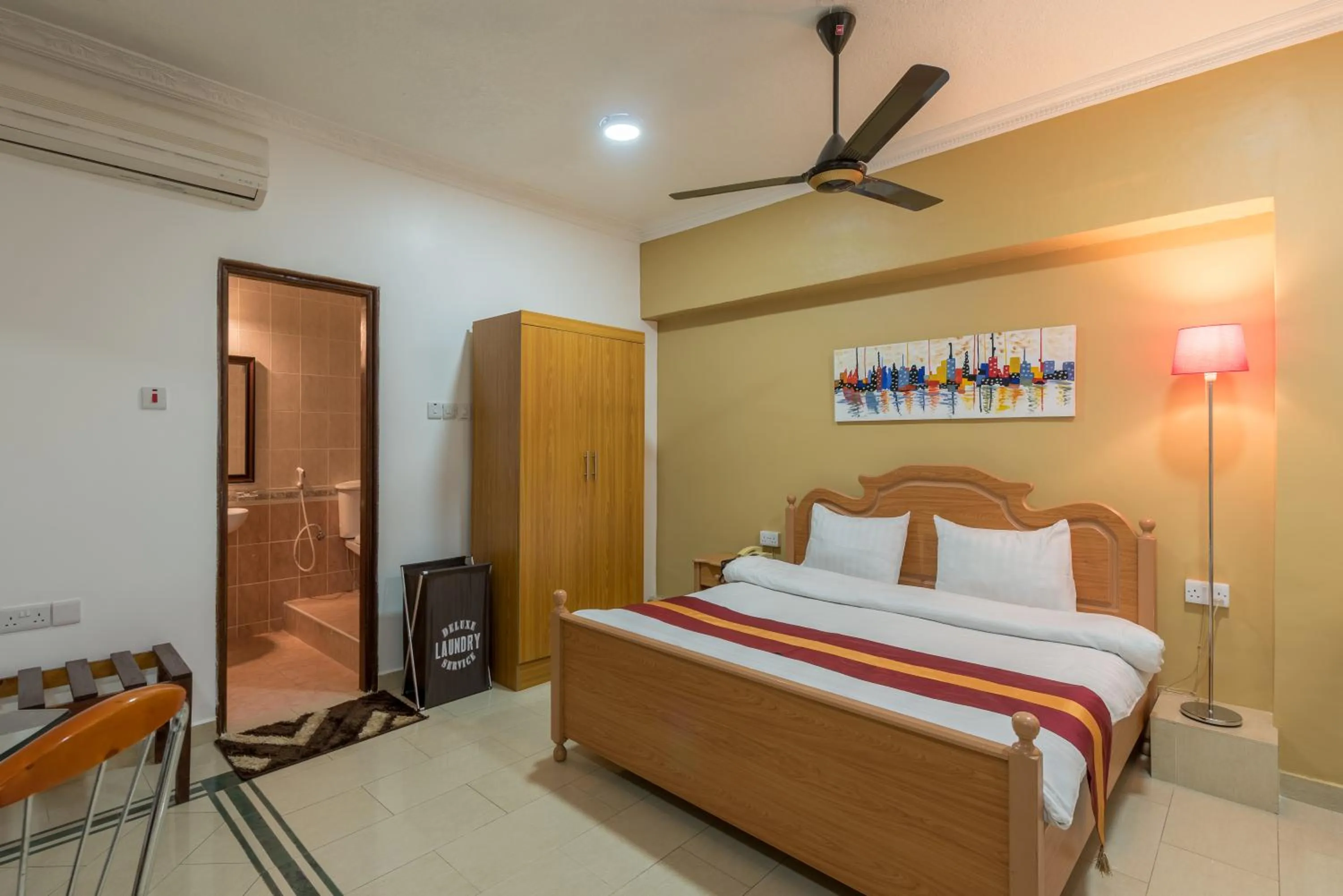 Bed in Hotel Raha Tower