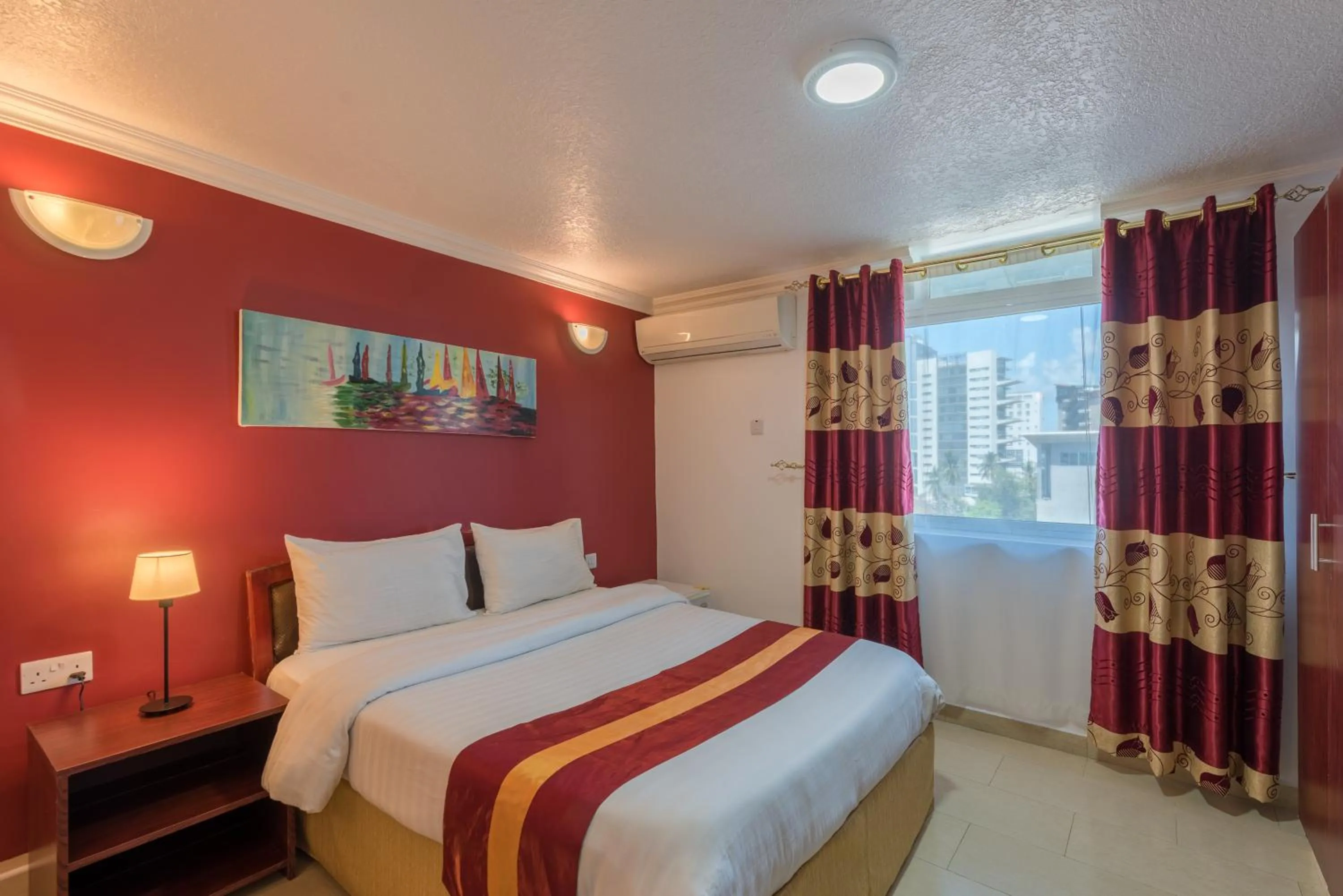 Bed in Hotel Raha Tower