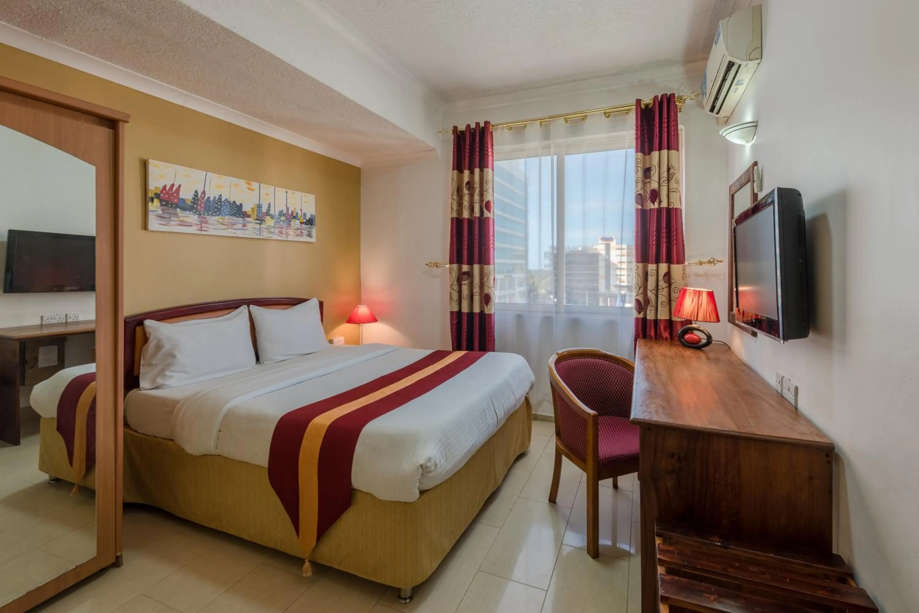 Bed in Hotel Raha Tower