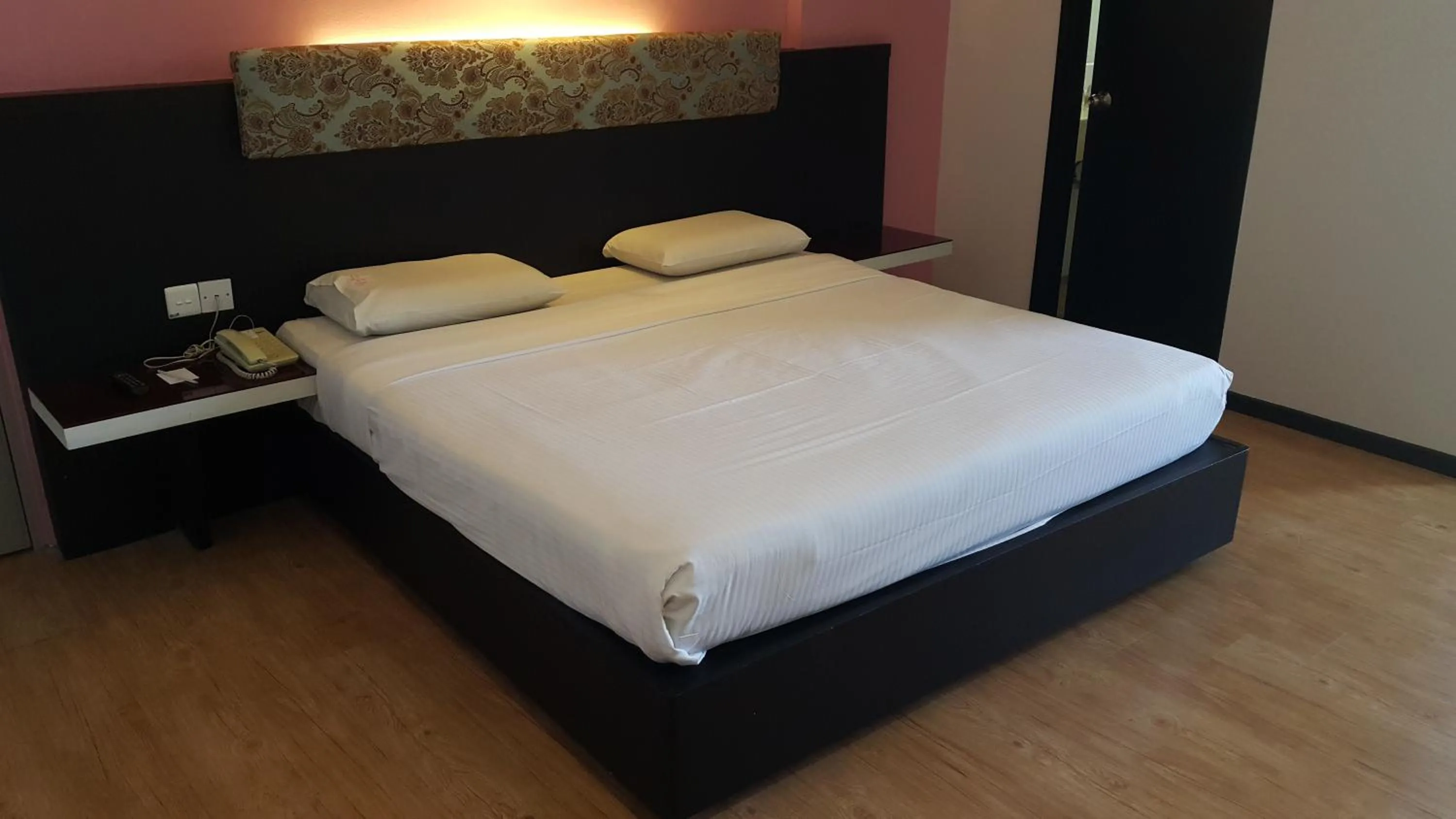 Bed in Red Rock Hotel Penang