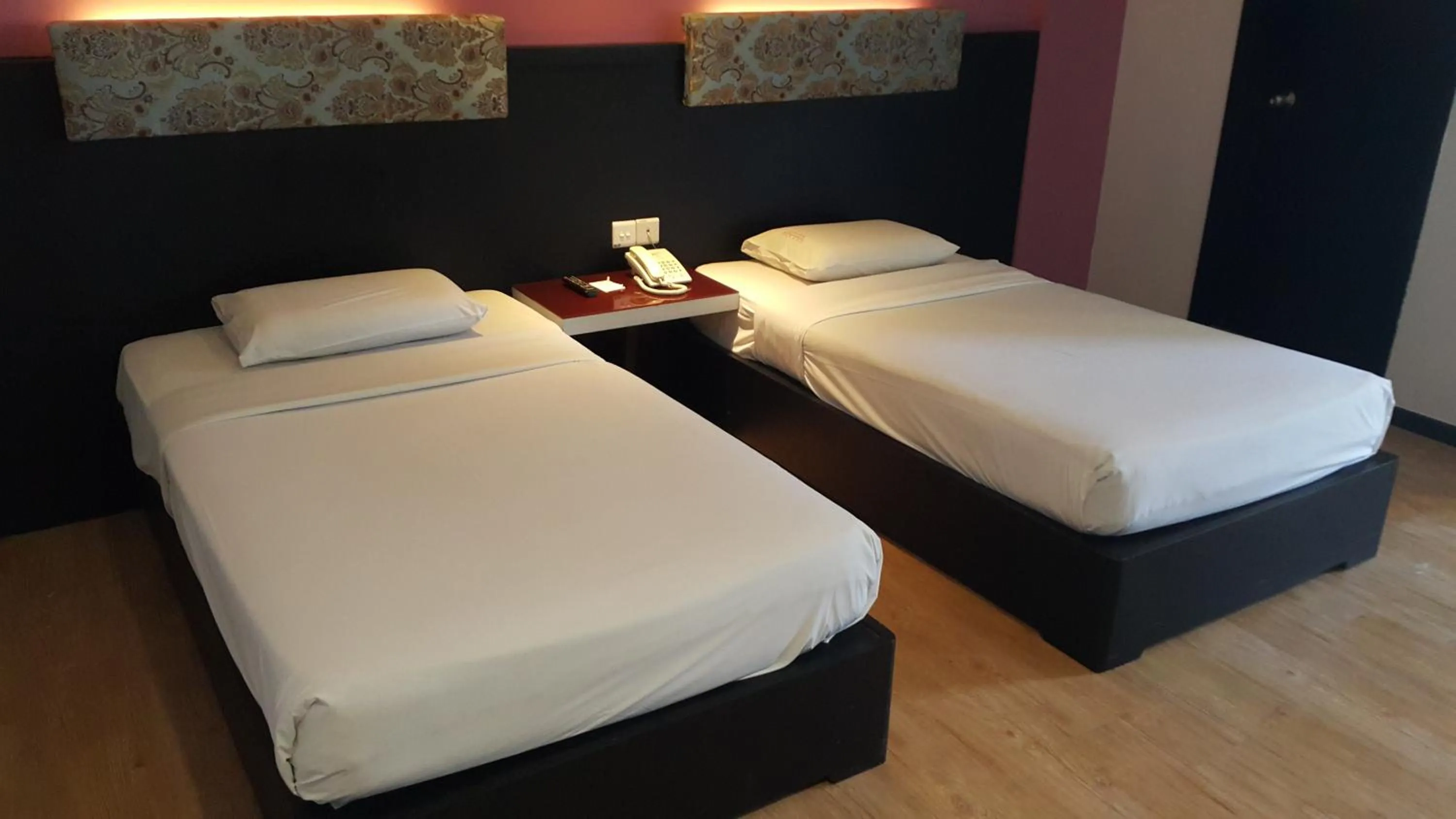 Bed in Red Rock Hotel Penang