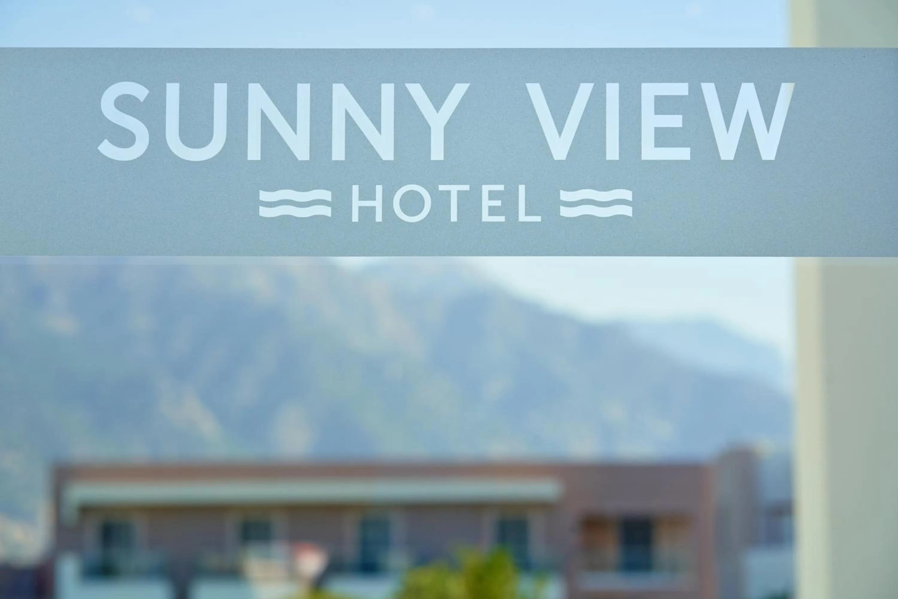 Property logo or sign in Sunny View Hotel