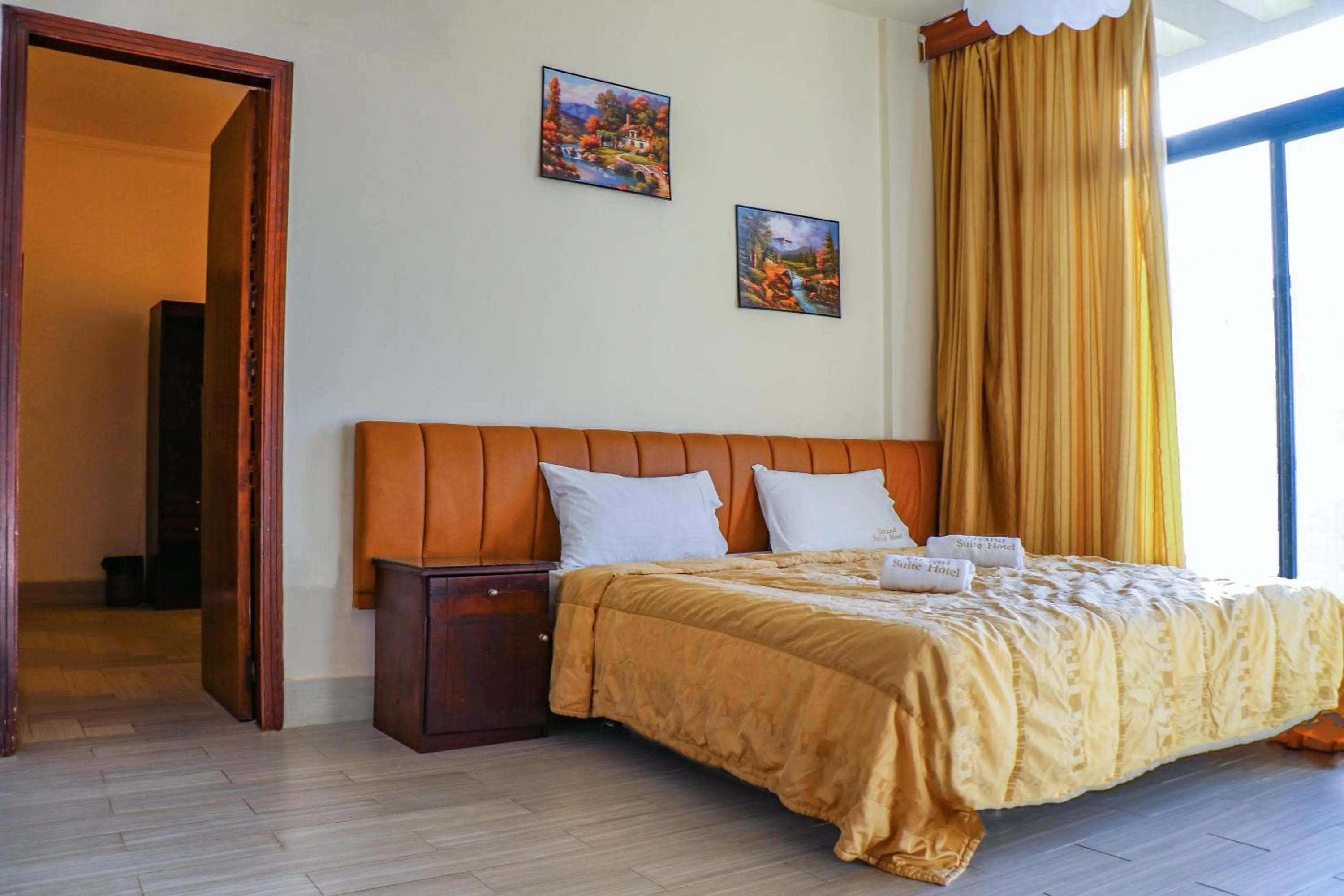 Bed in Grand Suites Hotel