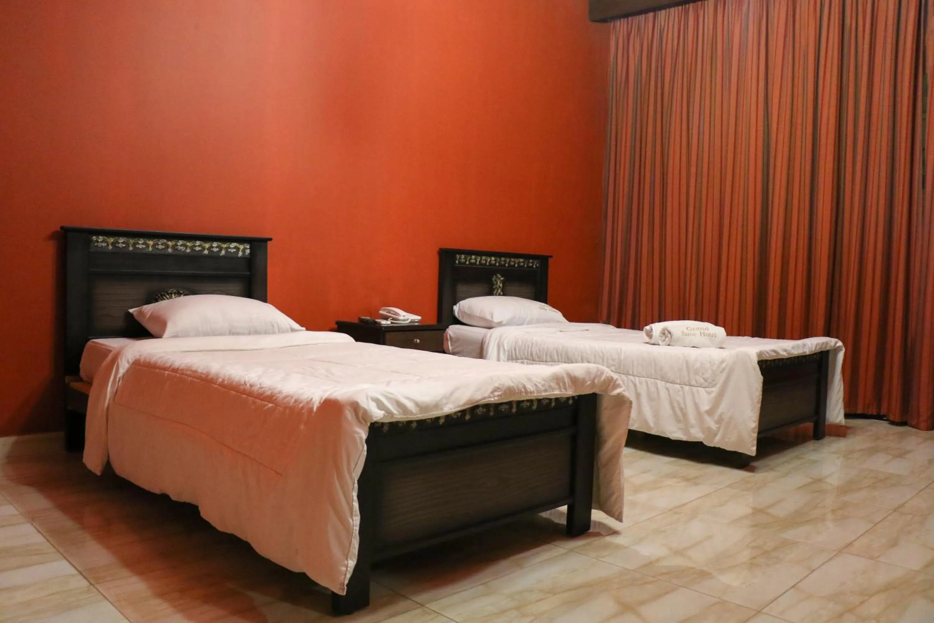 Bed in Grand Suites Hotel