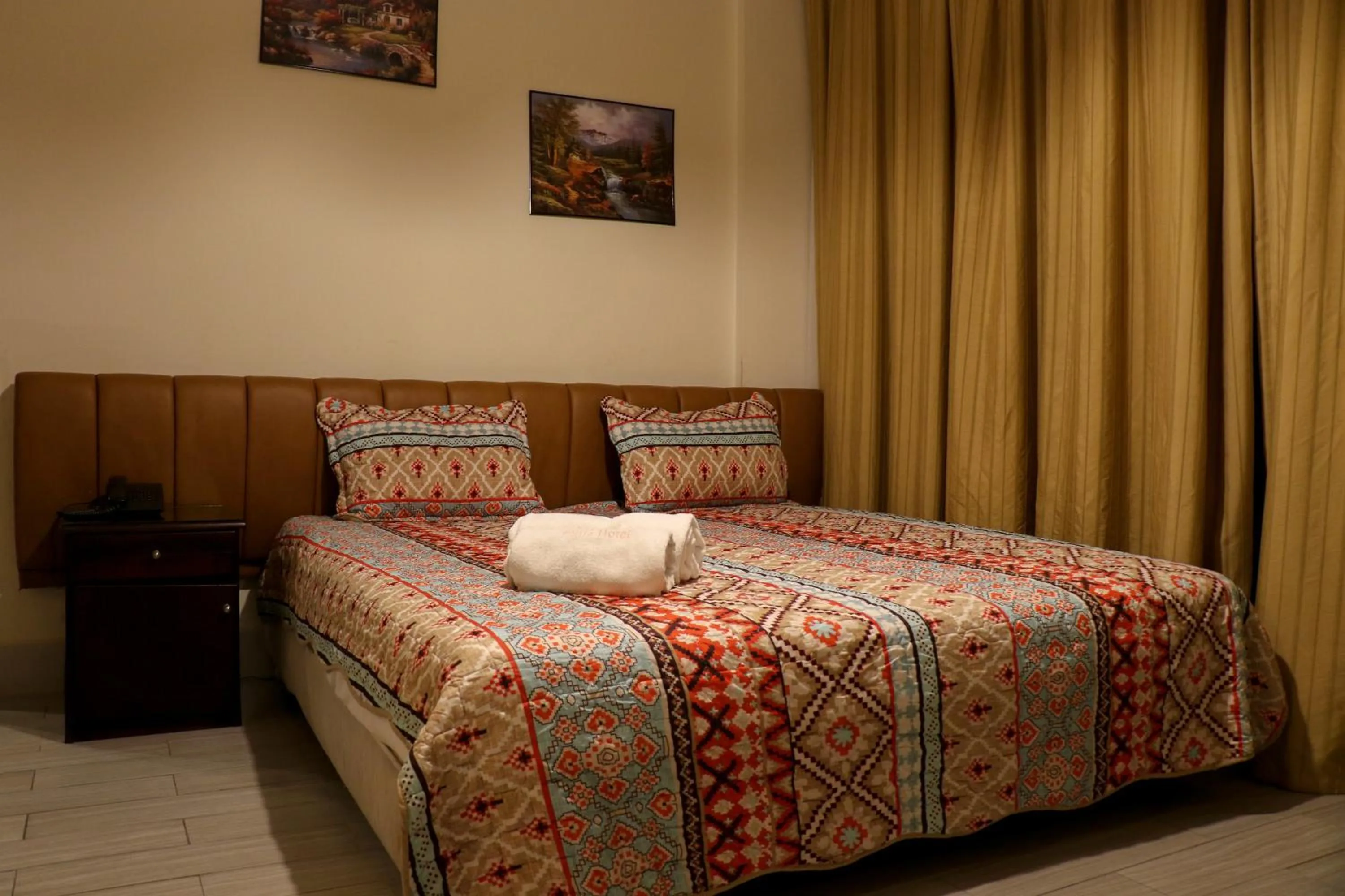 Bed in Grand Suites Hotel