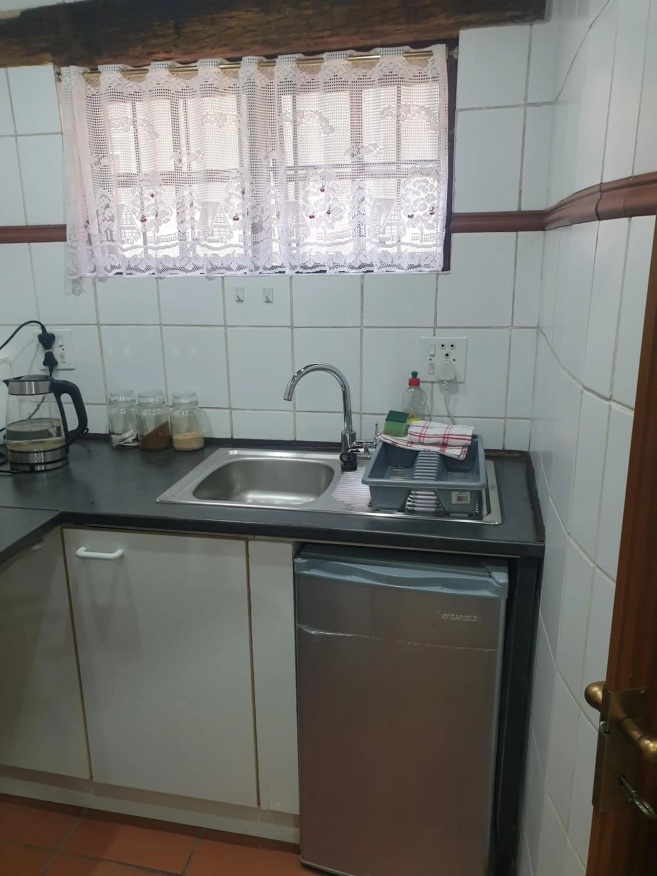 Kitchen or kitchenette in By Appointment Suites