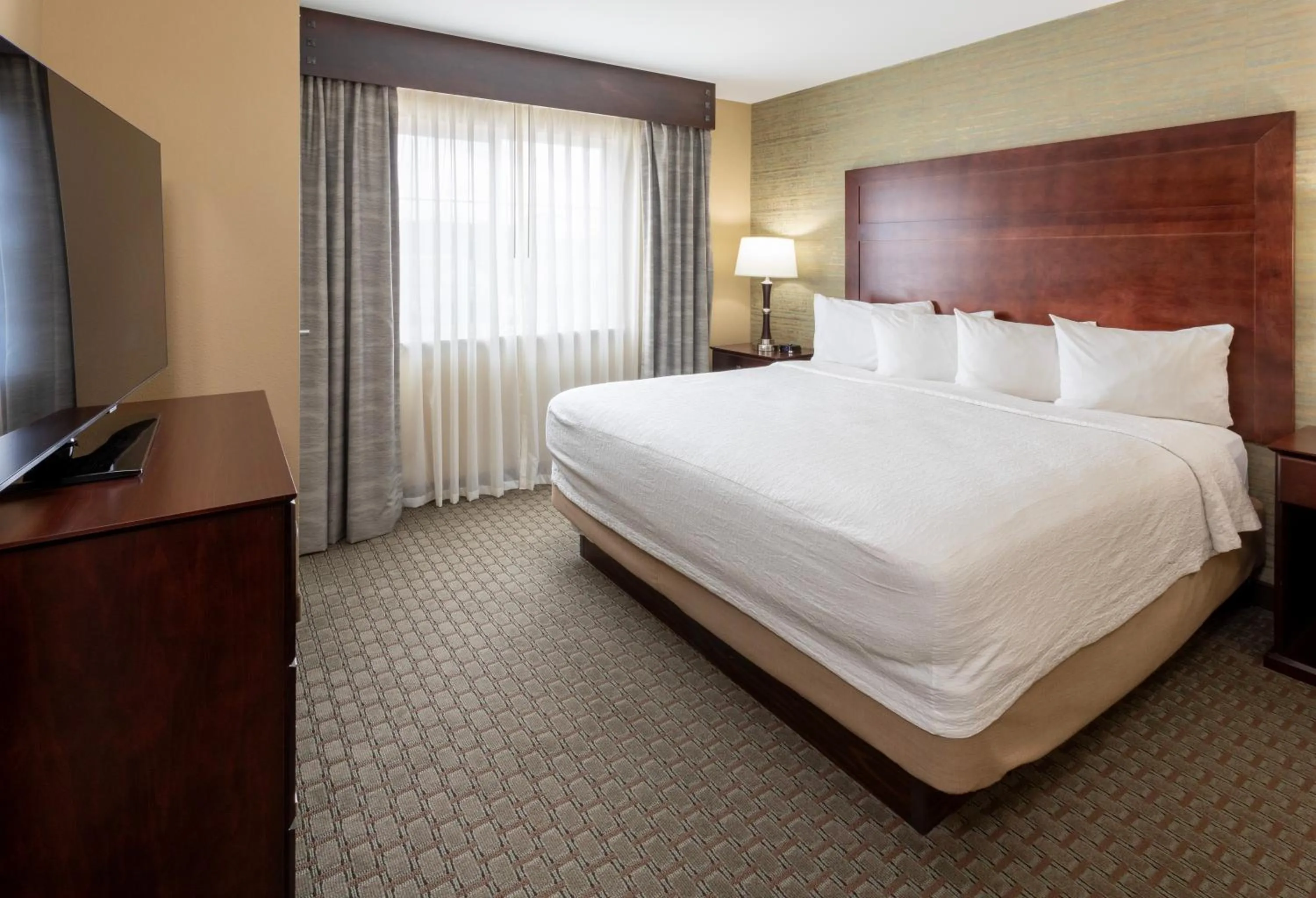 Bed in GrandStay Hotel & Suites - Morris