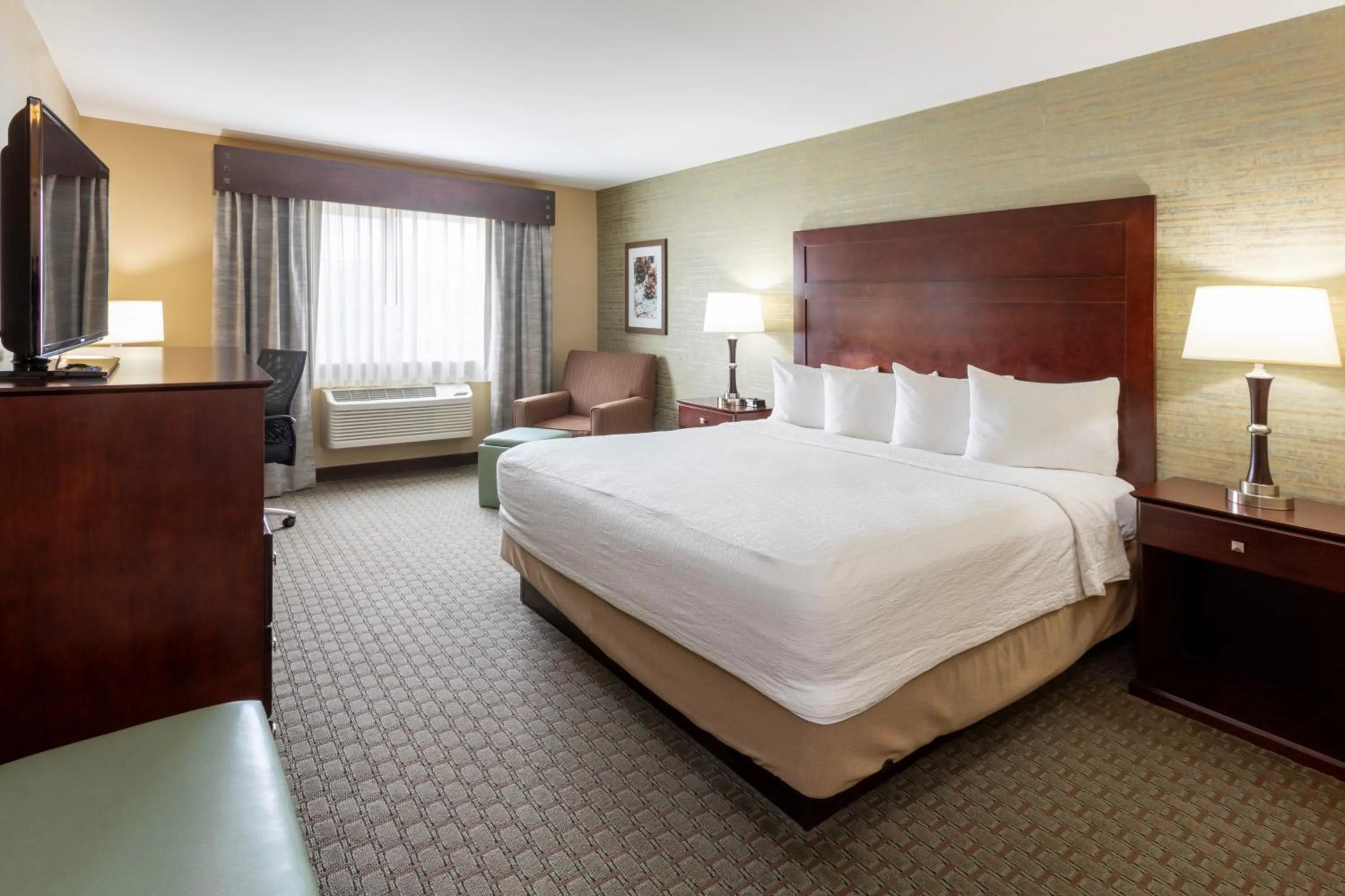 Photo of the whole room, Bed in GrandStay Hotel & Suites - Morris